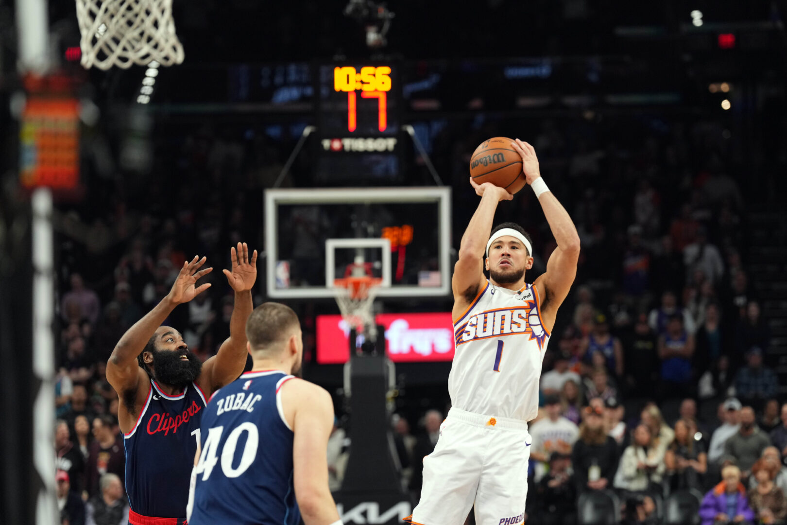 Jan 27, 2025; Phoenix, Arizona, USA; Phoenix Suns guard Devin Booker (1) shoots against the LA Clippers during the first half at Footprint Center. Mandatory Credit: Joe Camporeale-Imagn Images
