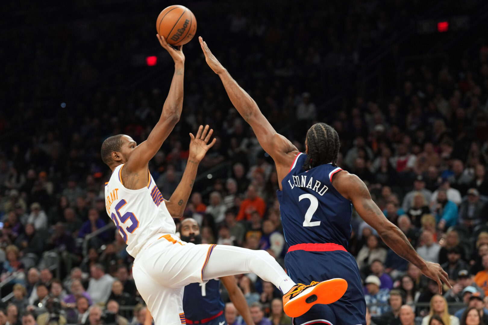 Jan 27, 2025; Phoenix, Arizona, USA; Phoenix Suns forward Kevin Durant (35) shoots over LA Clippers forward Kawhi Leonard (2) during the first half at Footprint Center. Mandatory Credit: Joe Camporeale-Imagn Images