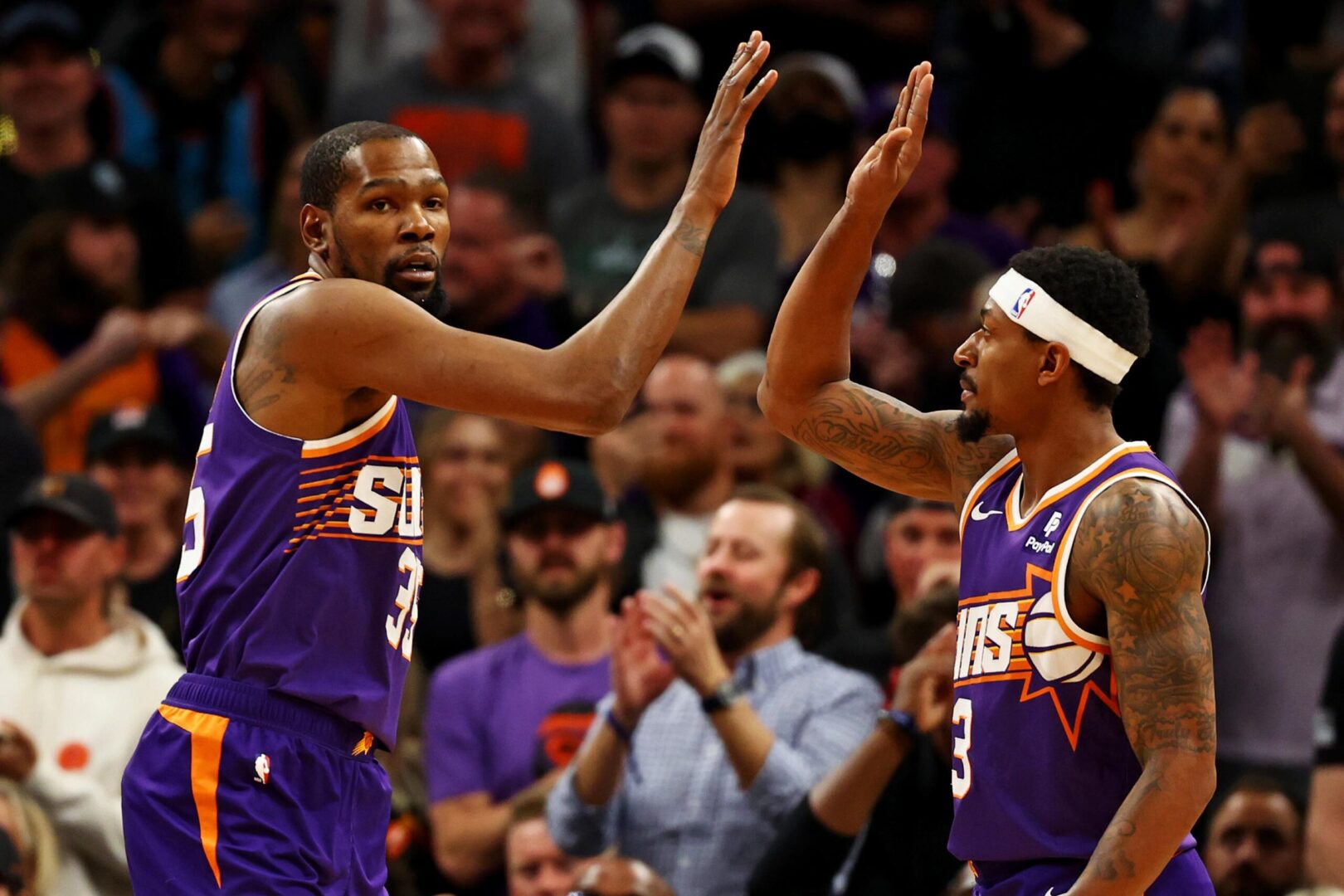 Mar 3, 2024; Phoenix, Arizona, USA; Phoenix Suns forward Kevin Durant (35) celebrates with guard Bradley Beal (3) during the first quarter of the game against the Oklahoma City Thunder at Footprint Center. Mandatory Credit: Mark J. Rebilas-Imagn Images