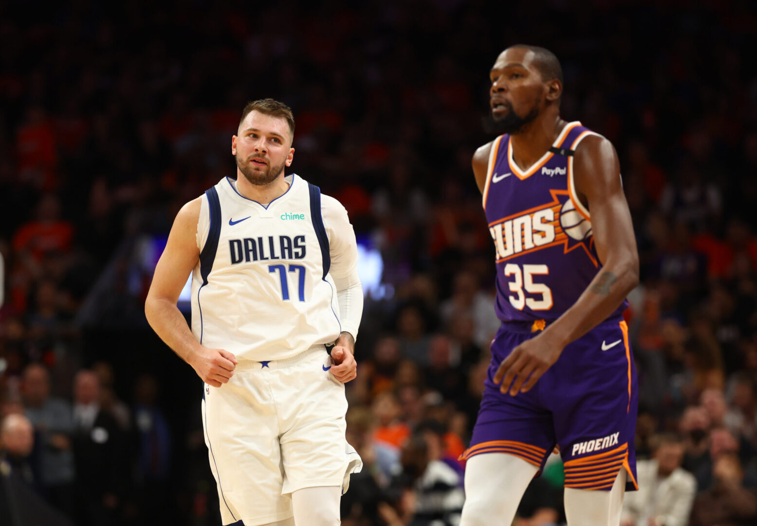 Oct 26, 2024; Phoenix, Arizona, USA; Dallas Mavericks guard Luka Doncic (77) against Phoenix Suns forward Kevin Durant (35) at Footprint Center. Mandatory Credit: Mark J. Rebilas-Imagn Images