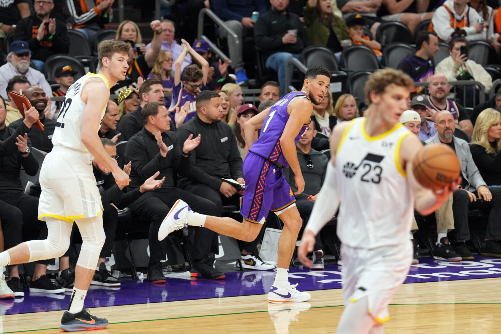 Jan 11, 2025; Phoenix, Arizona, USA; Phoenix Suns guard Devin Booker (1) reacts after making a three point basket against the Utah Jazz during the second half at Footprint Center. Mandatory Credit: Joe Camporeale-Imagn Images