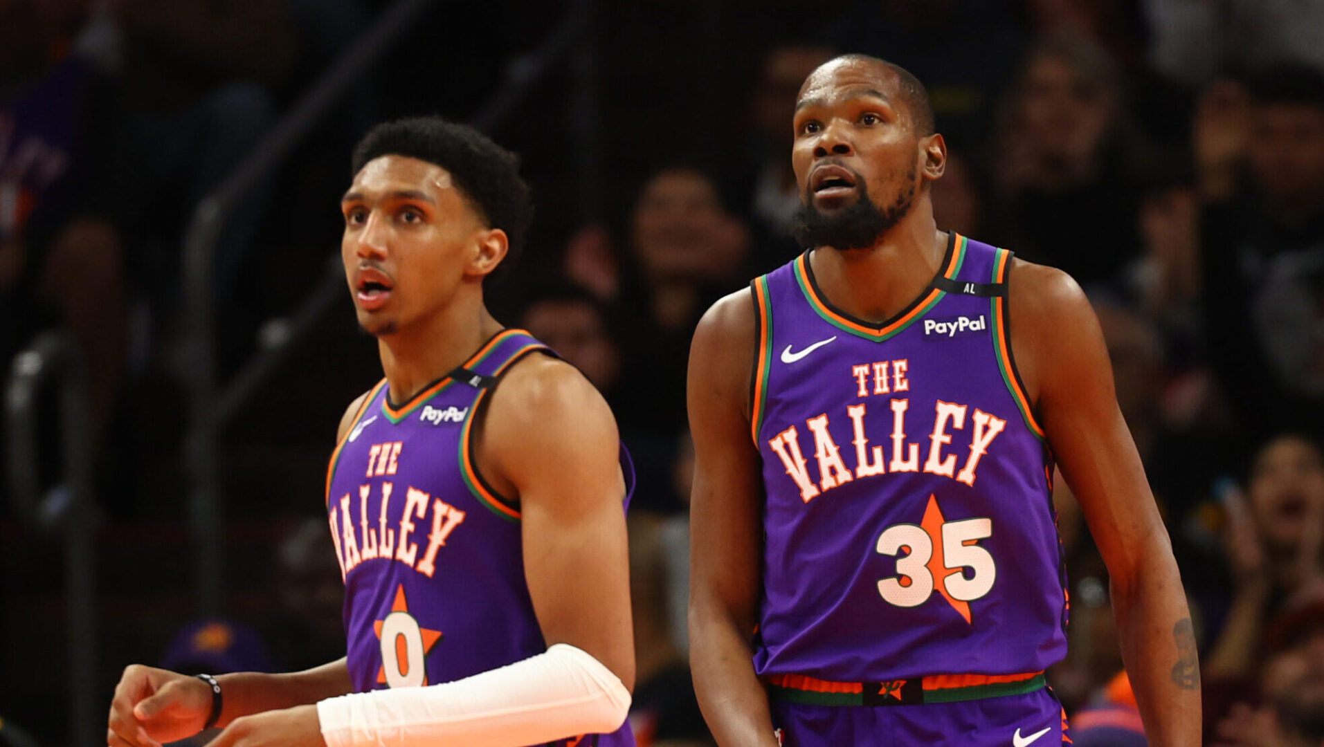 Jan 12, 2025; Phoenix, Arizona, USA; Phoenix Suns forward Ryan Dunn (0) and Kevin Durant (35) against the Charlotte Hornets at Footprint Center. Mandatory Credit: Mark J. Rebilas-Imagn Images