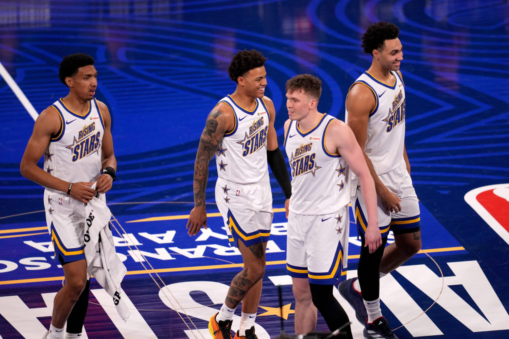 Feb 14, 2025; San Francisco, California, USA; Team C forward Ryan Dunn (0) of the Phoenix Suns, Team C guard Keyonte George (3) of the Utah Jazz,Team C forward Trayce Jackson-Davis (32) of the Golden State Warriors react after the 2025 NBA Rising Stars Game at Chase Center. Mandatory Credit: Cary Edmondson-Imagn Images