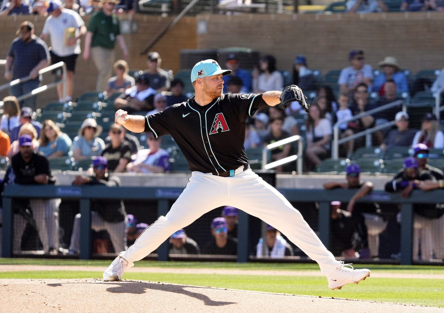 Arizona Diamondbacks pitcher Corbin Burnes throws to the Colorado Rockies in his debut on opening day of the spring training season at Salt River Fields at Talking Stick in Scottsdale on Feb. 21, 2025.