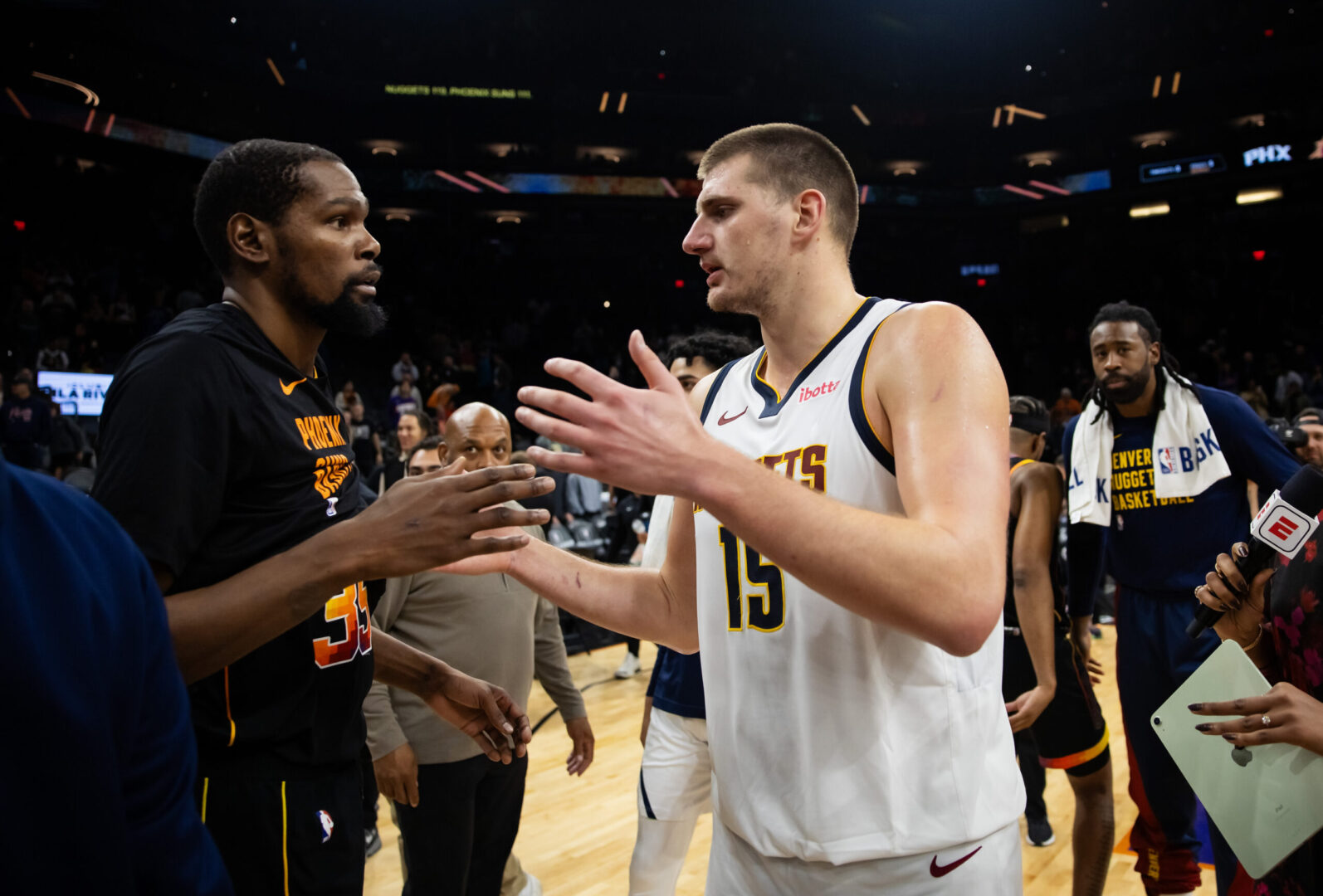 Dec 1, 2023; Phoenix, Arizona, USA; Denver Nuggets center Nikola Jokic (right) greets Phoenix Suns forward Kevin Durant following the game at Footprint Center. Mandatory Credit: Mark J. Rebilas-Imagn Images