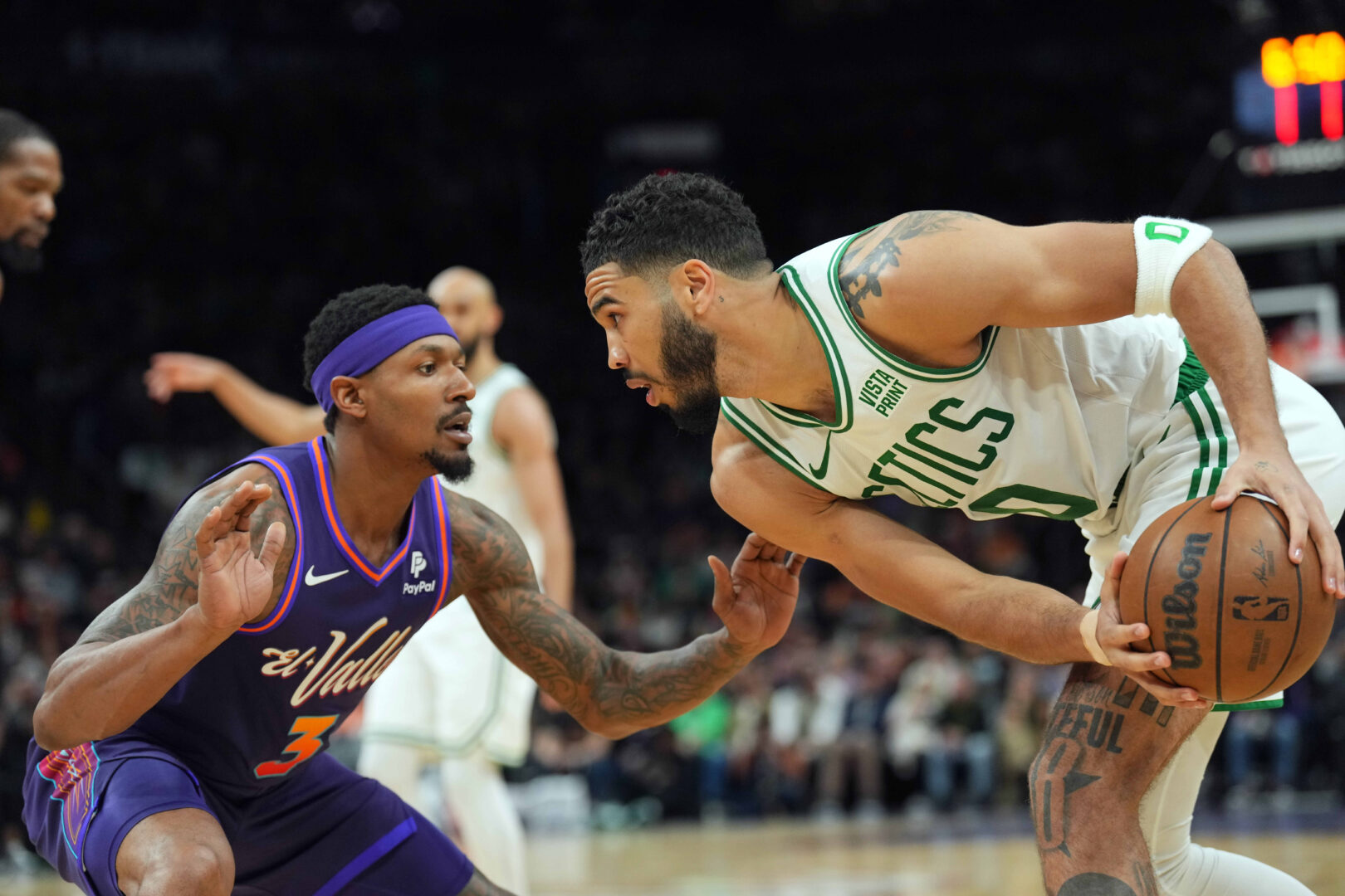 Mar 9, 2024; Phoenix, Arizona, USA; Phoenix Suns guard Bradley Beal (3) guards Boston Celtics forward Jayson Tatum (0) during the second half at Footprint Center. Mandatory Credit: Joe Camporeale-Imagn Images