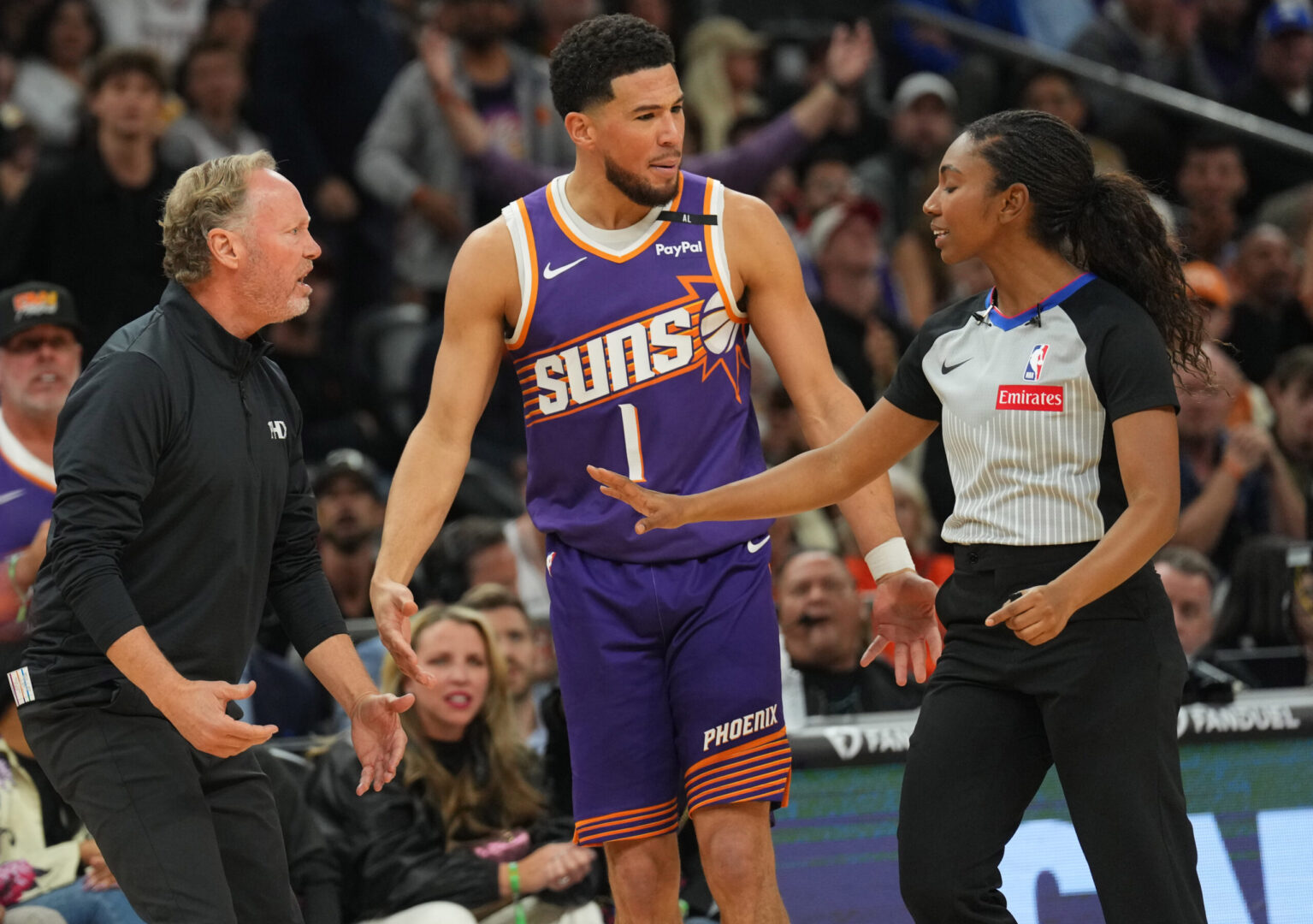 Nov 6, 2024; Phoenix, Arizona, USA; Phoenix Suns head coach Mike Budenholzer and Phoenix Suns guard Devin Booker (1) argue a call during the second half of the game against the Miami Heat at Footprint Center. Mandatory Credit: Joe Camporeale-Imagn Images