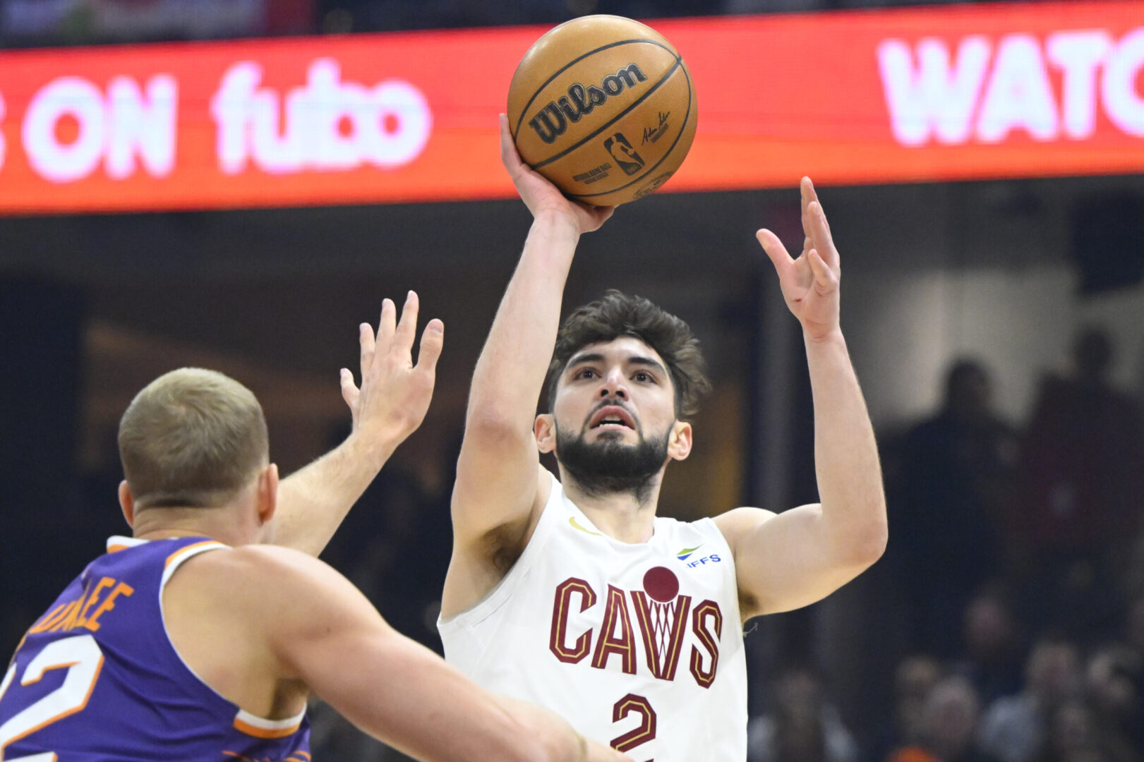 Jan 20, 2025; Cleveland, Ohio, USA; Cleveland Cavaliers guard Ty Jerome (2) shoots beside Phoenix Suns center Mason Plumlee (22) in the first quarter at Rocket Mortgage FieldHouse. Mandatory Credit: David Richard-Imagn Images