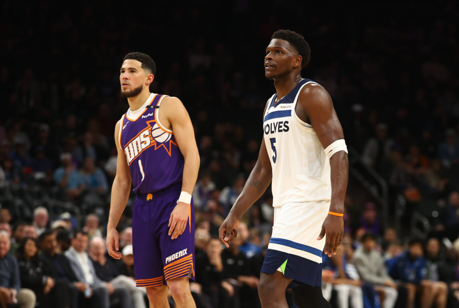 Jan 29, 2025; Phoenix, Arizona, USA; Minnesota Timberwolves guard Anthony Edwards (5) against Phoenix Suns guard Devin Booker (1) at Footprint Center. Mandatory Credit: Mark J. Rebilas-Imagn Images