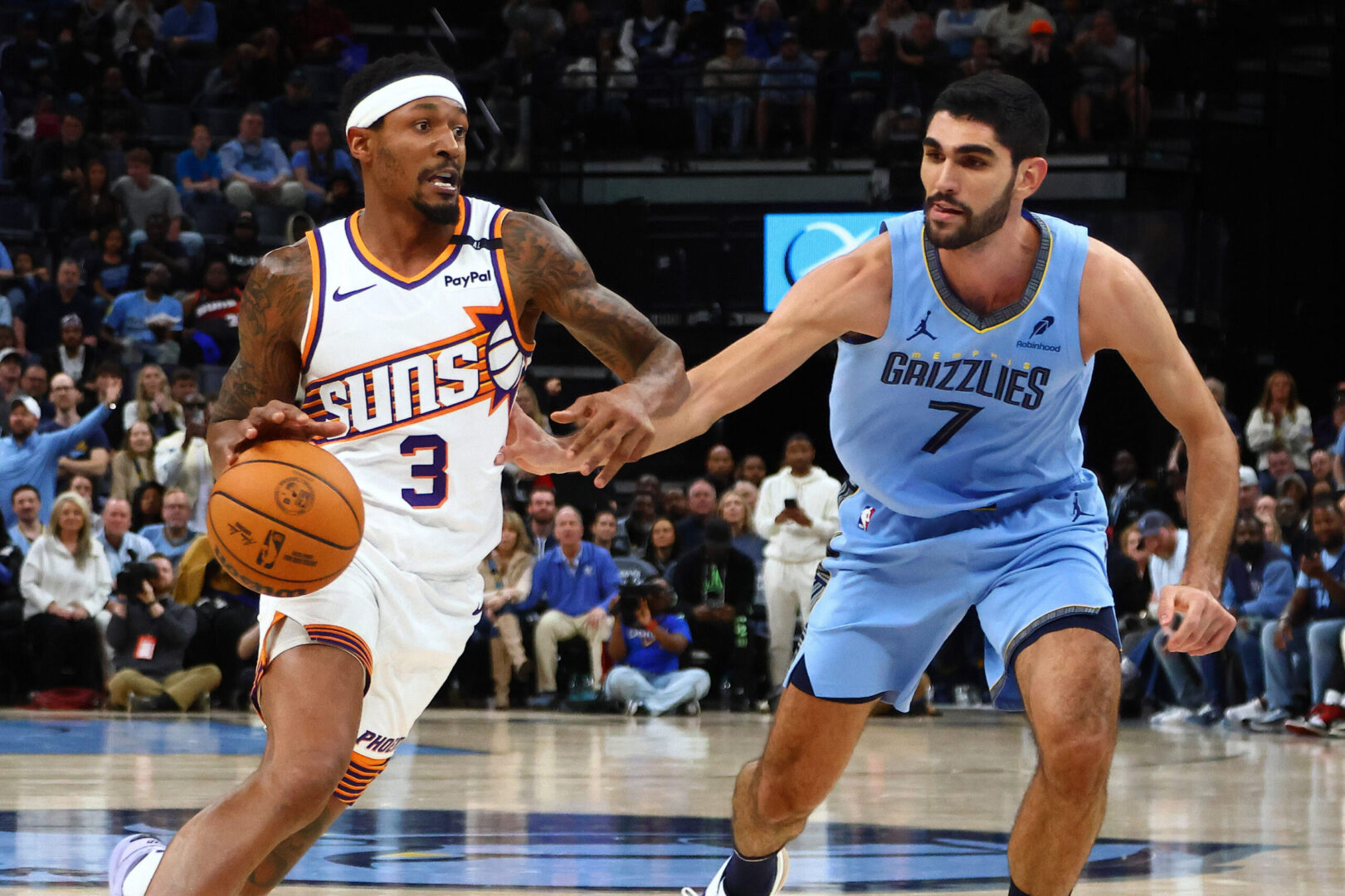 Feb 25, 2025; Memphis, Tennessee, USA; Phoenix Suns guard Bradley Beal (3) drives to the basket as Memphis Grizzlies forward Santi Aldama (7) defends during the fourth quarter at FedExForum. Mandatory Credit: Petre Thomas-Imagn Images