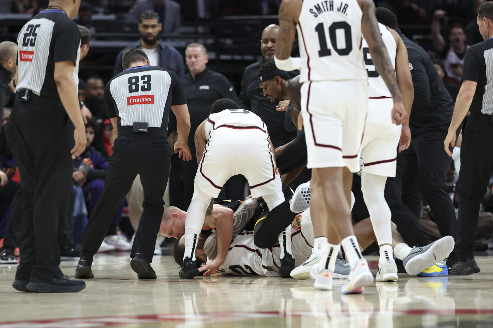 Mar 12, 2025; Houston, Texas, USA; Phoenix Suns center Mason Plumlee (22) and Houston Rockets center Steven Adams (12) have a physical altercation during the first half of the game at Toyota Center. Mandatory Credit: Troy Taormina-Imagn Images