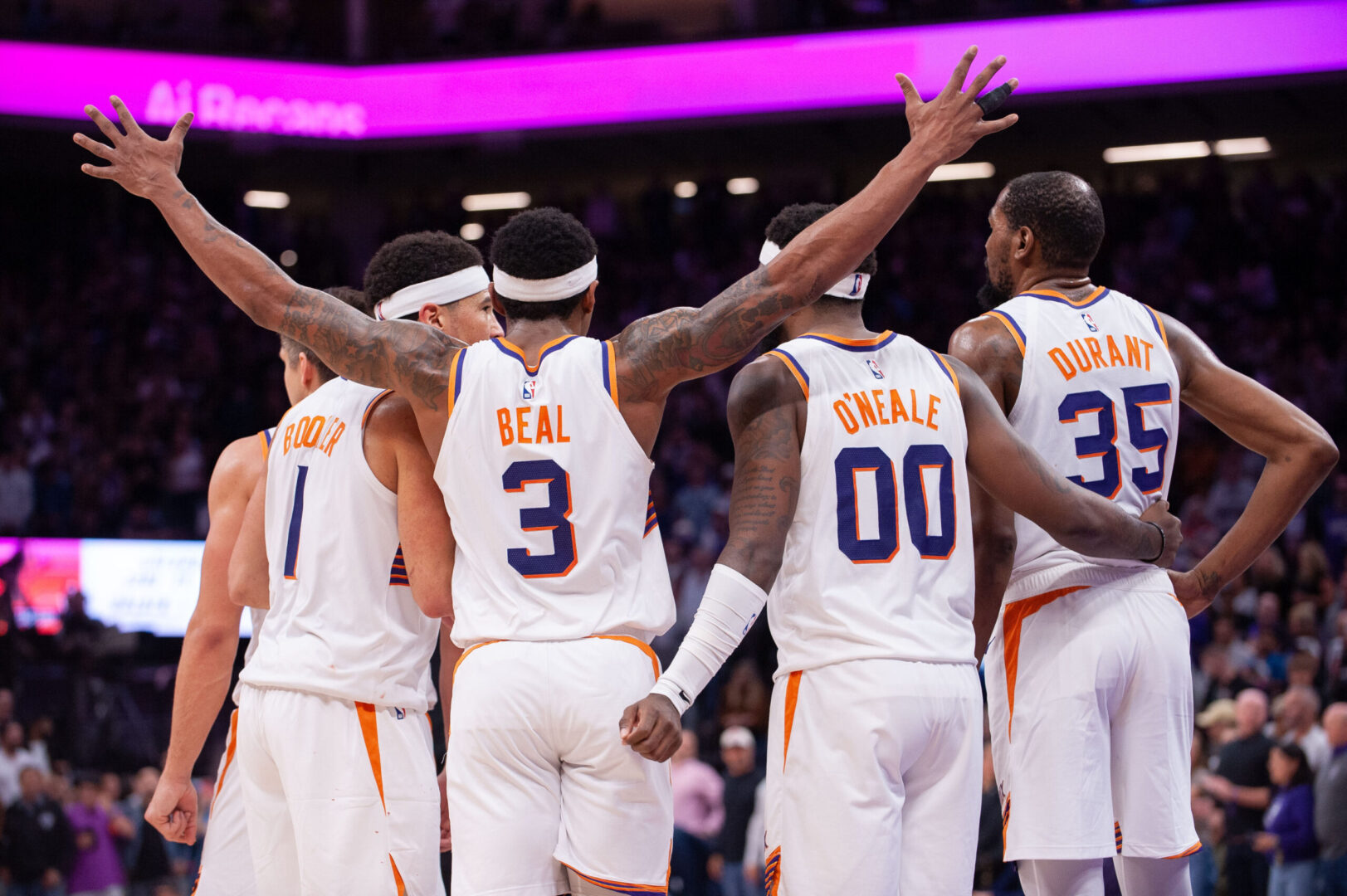 Apr 12, 2024; Sacramento, California, USA; Phoenix Suns guard Grayson Allen (8) and guard Devin Booker (1) and guard Bradley Beal (3) and forward Royce O'Neale (00) and forward Kevin Durant (35) huddle up before the final seconds of the fourth quarter at Golden 1 Center. Mandatory Credit: Ed Szczepanski-Imagn Images