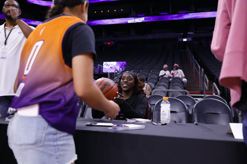 Phoenix Mercury's Kahleah Copper interacting with a young fan. Credits - Phoenix Mercury