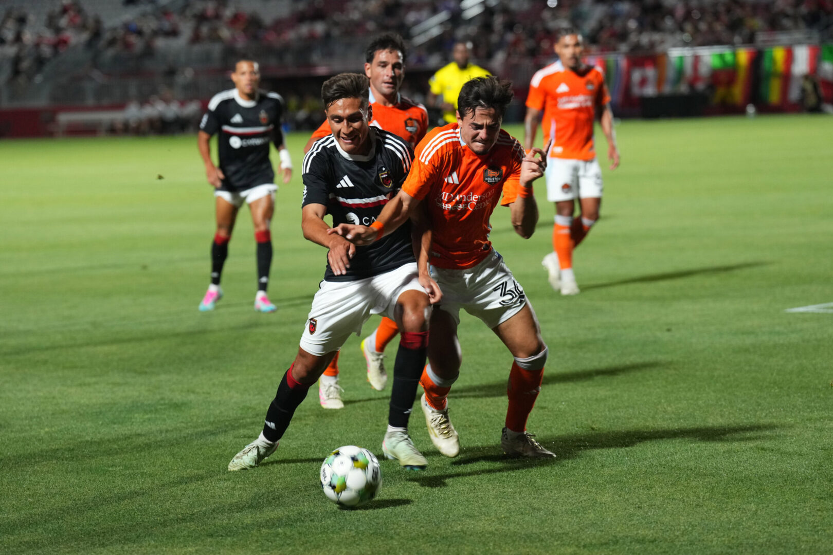 Houston Dynamo defender Felipe Andrade defends against Phoenix Rising midfielder JP Scearce on May 7, 2025. Credit: Joe Camporeale-Imagn Images