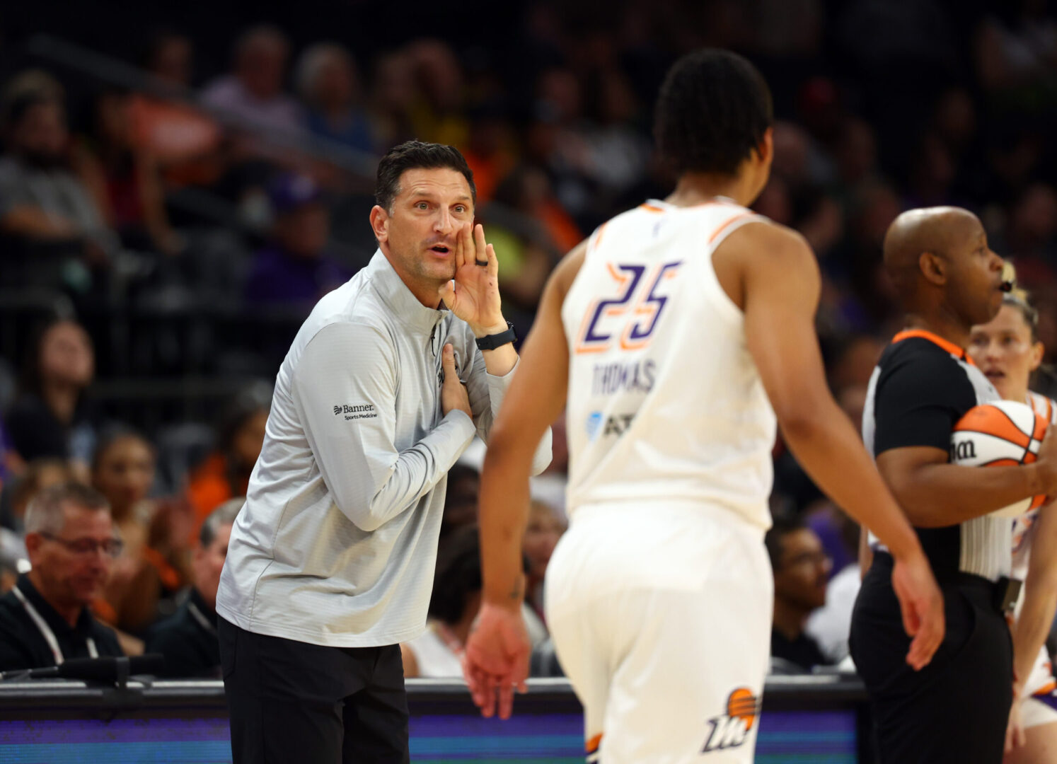 May 11, 2025; Phoenix, AZ, USA; Phoenix Mercury head coach Nate Tibbetts talks to forward Alyssa Thomas (25) against the Golden State Valkyries during a preseason game at PHX Arena. Mandatory Credit: Mark J. Rebilas-Imagn Images