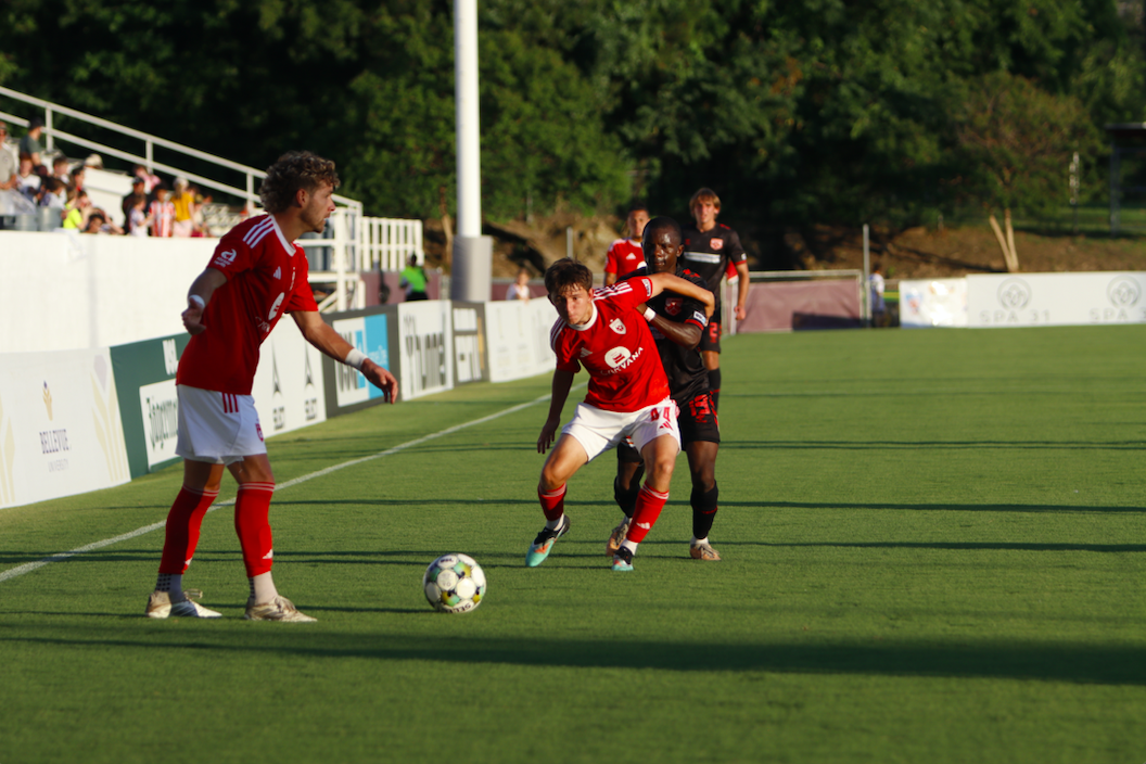 Phoenix Rising's Ryan Flood looks to pass while Jamison Ping defends against Texoma FC on June 28, 2025. Credit: Phoenix Rising FC