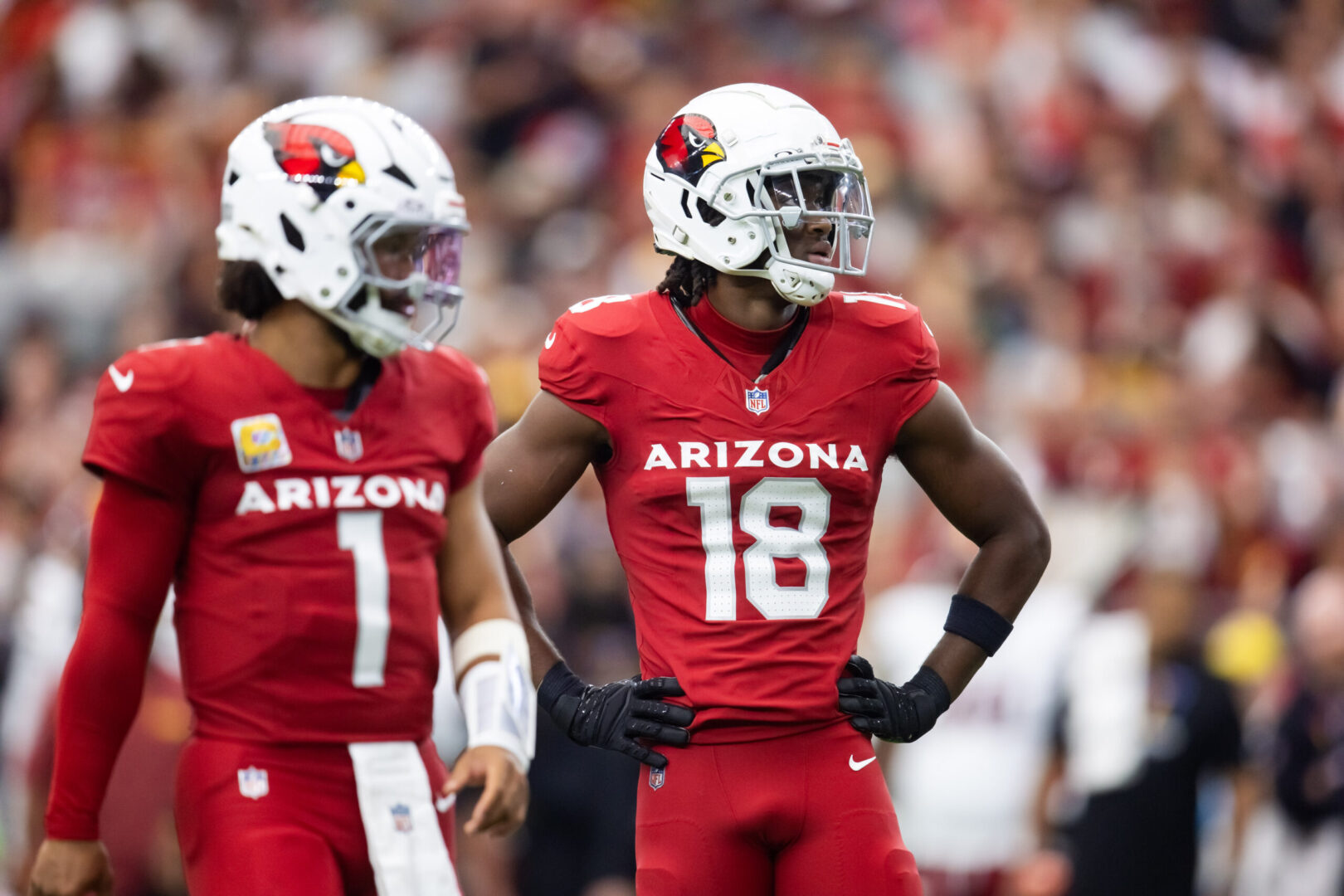 Sep 29, 2024; Glendale, Arizona, USA; Arizona Cardinals wide receiver Marvin Harrison Jr. (18) alongside quarterback Kyler Murray (1) against the Washington Commanders in the first half at State Farm Stadium. Mandatory Credit: Mark J. Rebilas-Imagn Images Cardinals