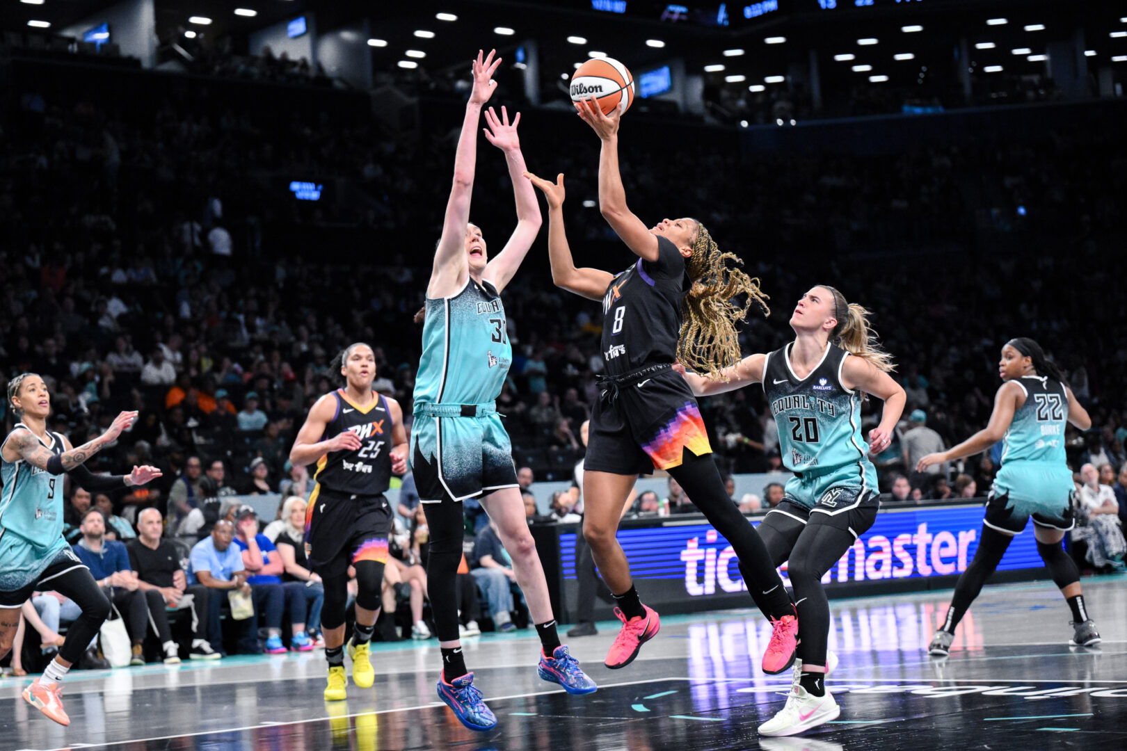 Phoenix Mercury guard Monique Akoa Makani drives to the basket as New York Liberty forward Breanna Stewart defends during on June 19, 2025. Credit: John Jones-Imagn Images