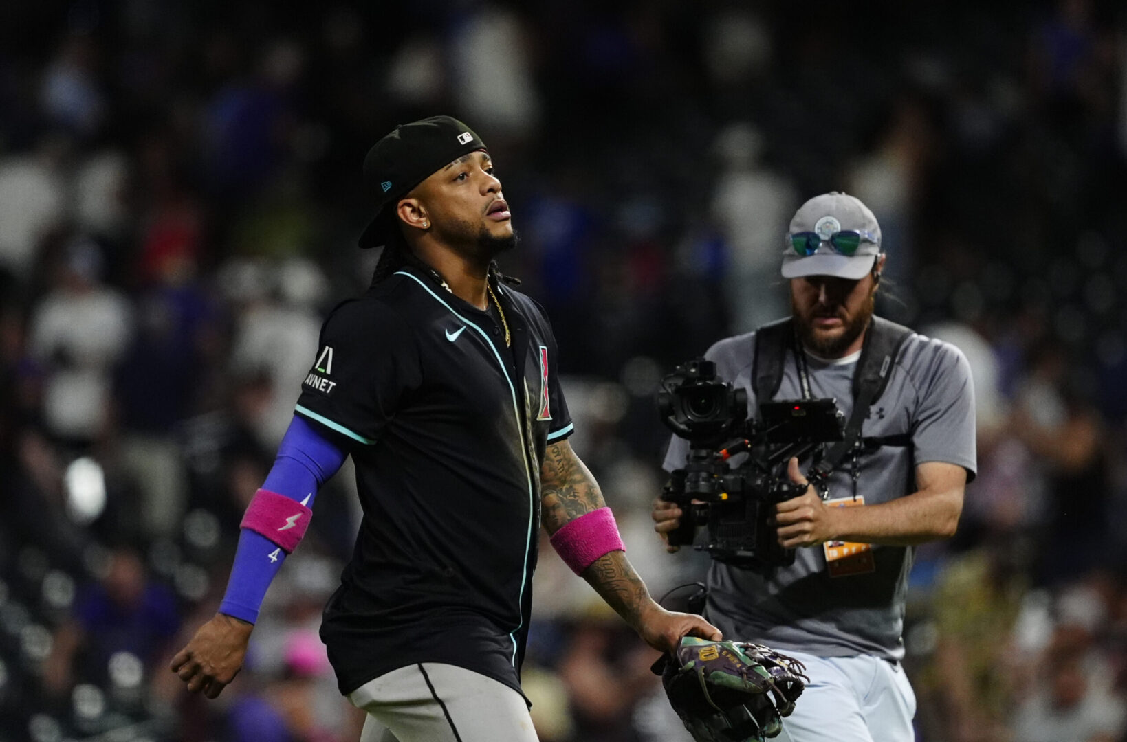 Jun 21, 2025; Denver, Colorado, USA; Arizona Diamondbacks second baseman Ketel Marte (4) looks on following the win against the Colorado Rockies at Coors Field. Mandatory Credit: Ron Chenoy-Imagn Images