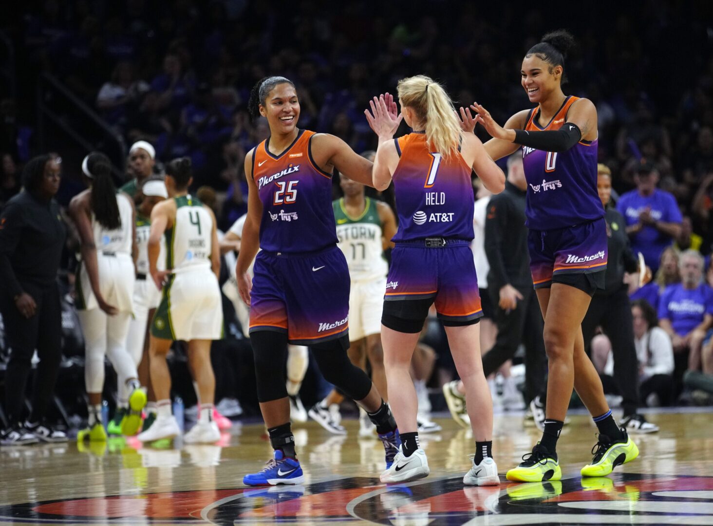 Phoenix Mercury forwards Satou Sabally and Alyssa Thomas and guard Lexi Held celebrate after forcing a Seattle Storm timeout on May 17, 2025. © Patrick Breen/The Republic / USA TODAY NETWORK via Imagn Images