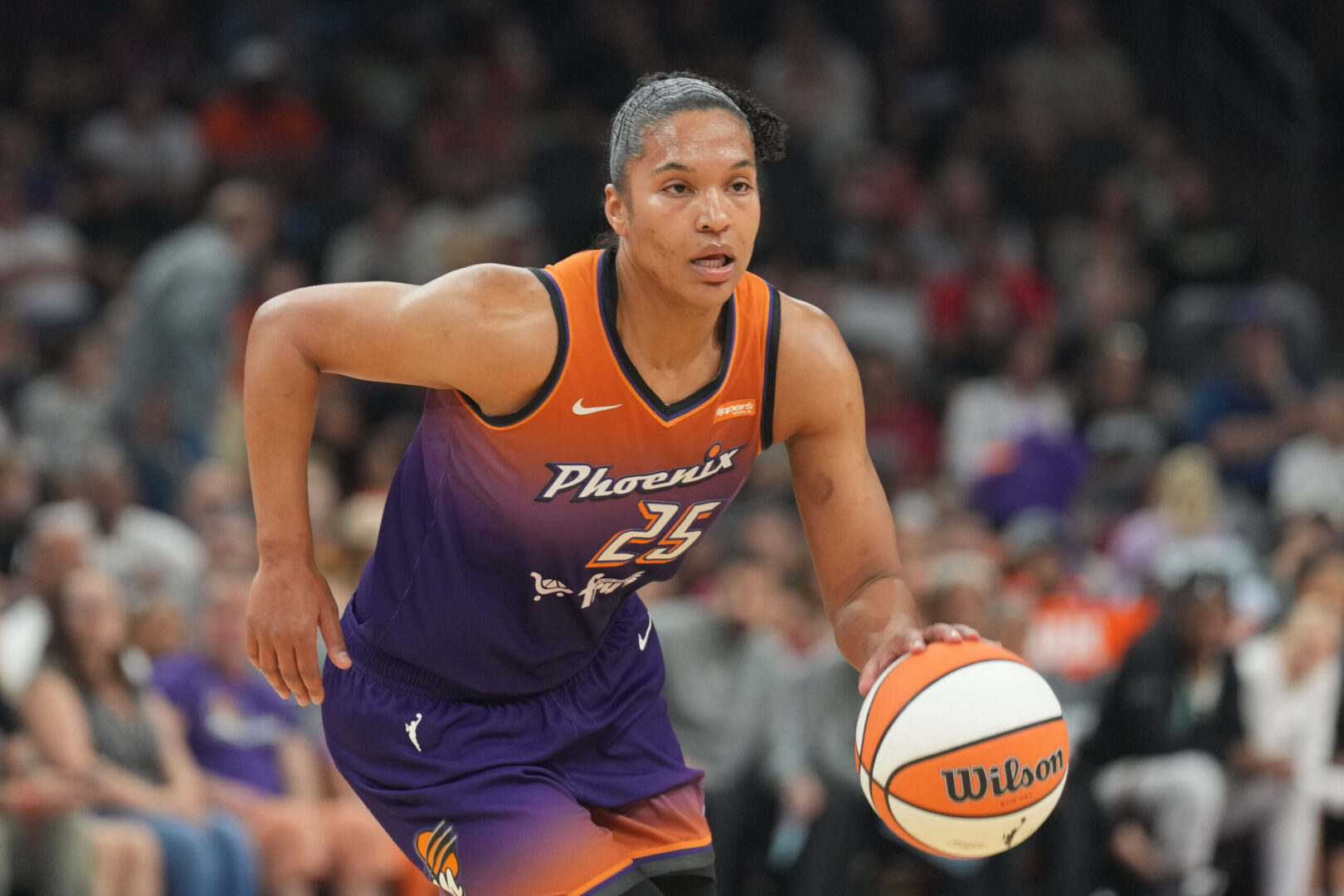 Jun 27, 2025; Phoenix, Arizona, USA; Phoenix Mercury forward Alyssa Thomas (25) dribbles against the New York Liberty during the first half at Footprint Center. Mandatory Credit: Joe Camporeale-Imagn Images