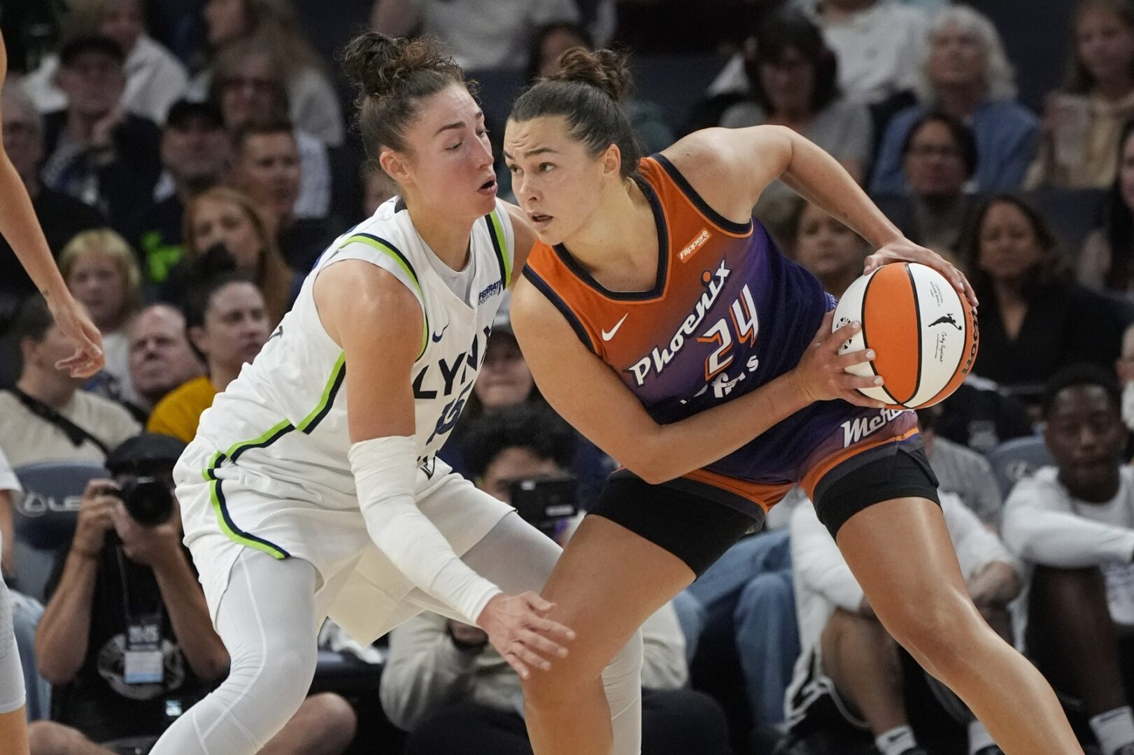 Jul 16, 2025; Minneapolis, Minnesota, USA; Phoenix Mercury forward Kathryn Westbeld (24) works around Minnesota Lynx forward Jessica Shepard (15) in the second quarter at Target Center. Mandatory Credit: Bruce Kluckhohn-Imagn Images