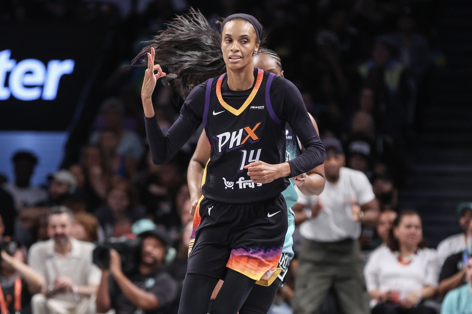 Jul 25, 2025; Brooklyn, New York, USA; Phoenix Mercury forward DeWanna Bonner (14) gestures after making a three-point shot in the second quarter against the New York Liberty at Barclays Center. Mandatory Credit: Wendell Cruz-Imagn Images