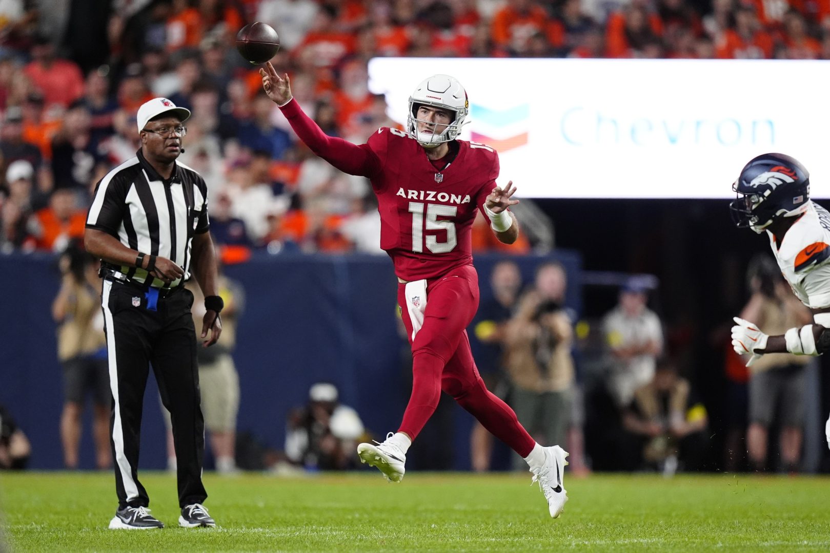 Aug 16, 2025; Denver, Colorado, USA; Arizona Cardinals quarterback Clayton Tune (15) passes the ball in the second quarter against the Denver Broncos at Empower Field at Mile High. Mandatory Credit: Ron Chenoy-Imagn Images