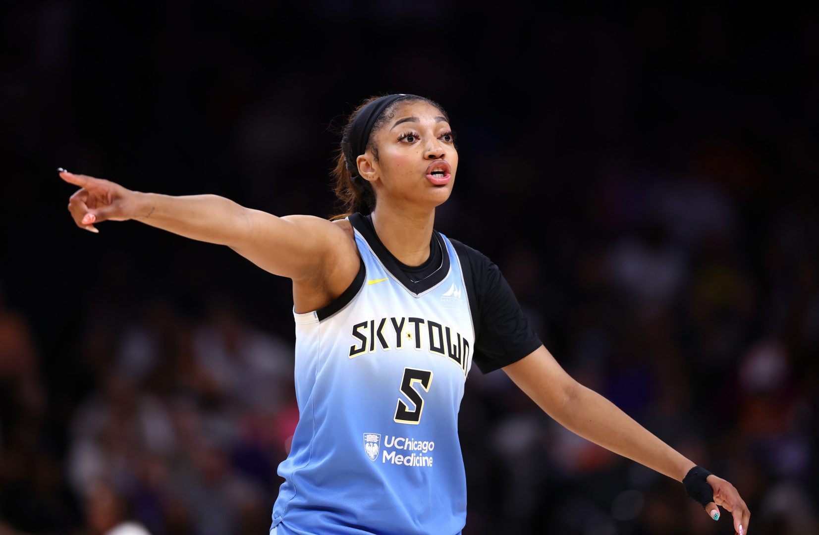 Aug 28, 2025; Phoenix, Arizona, USA; Chicago Sky forward Angel Reese (5) reacts against the Phoenix Mercury in the first half at Phx Arena. Mandatory Credit: Mark J. Rebilas-Imagn Images