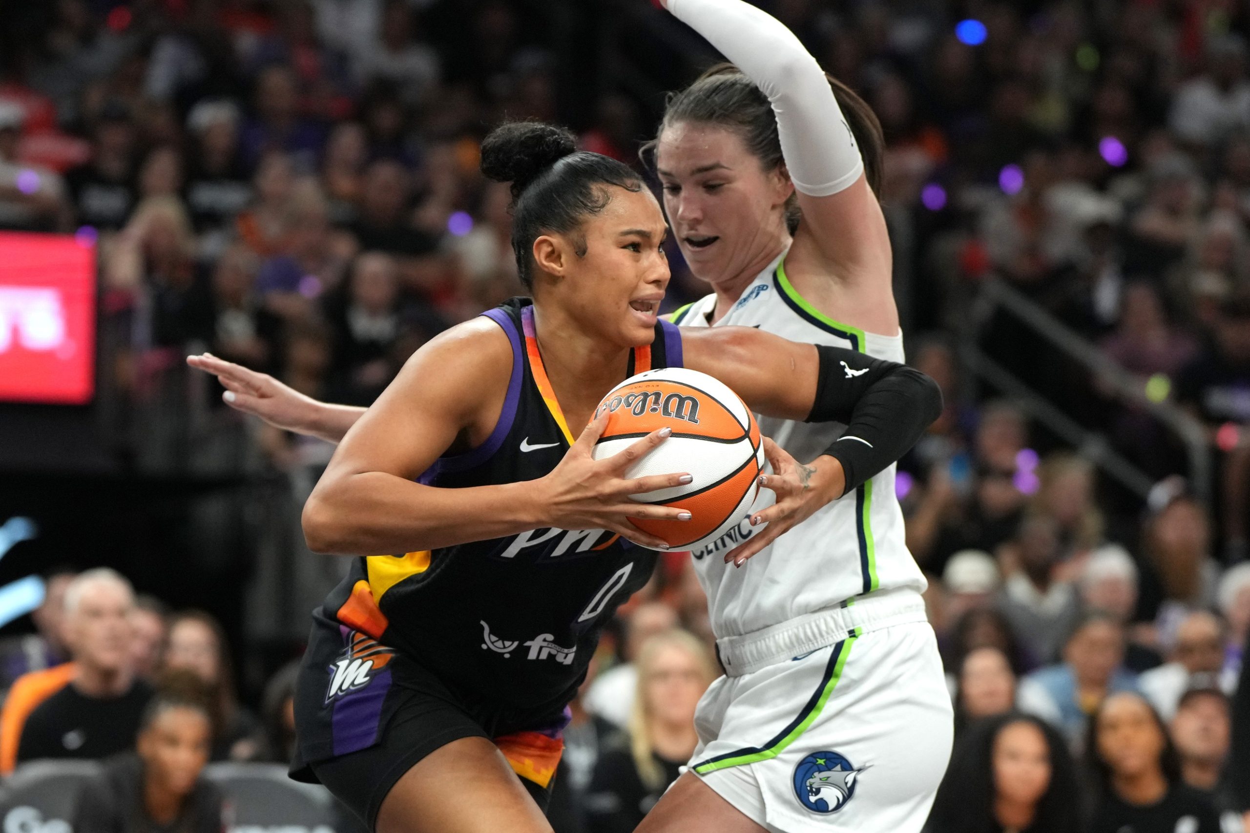Sep 28, 2025; Phoenix, Arizona, USA; Phoenix Mercury forward Satou Sabally (0) drives on Minnesota Lynx forward Bridget Carleton (6) in the first half during game four of the second round for the 2025 WNBA Playoffs at PHX Arena. Mandatory Credit: Rick Scuteri-Imagn Images