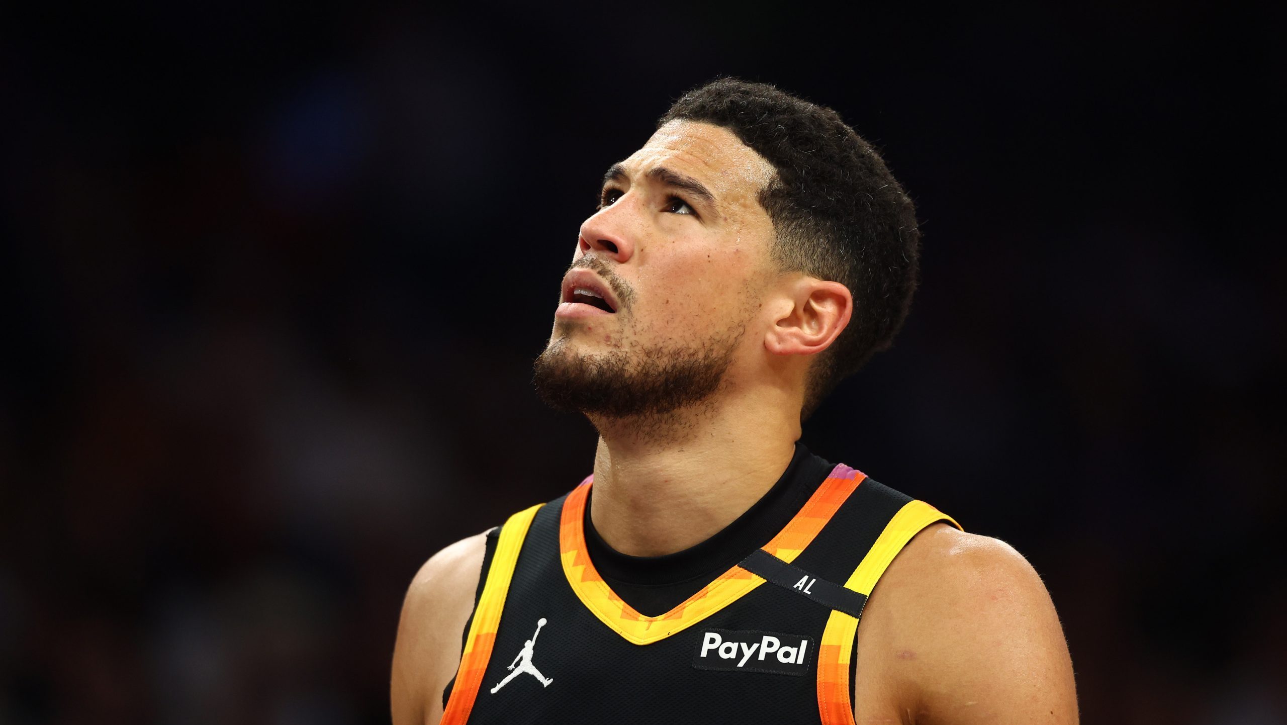 Apr 9, 2025; Phoenix, Arizona, USA; Phoenix Suns guard Devin Booker (1) reacts after a play against the Oklahoma City Thunder during the first half at Footprint Center. Mandatory Credit: Mark J. Rebilas-Imagn Images