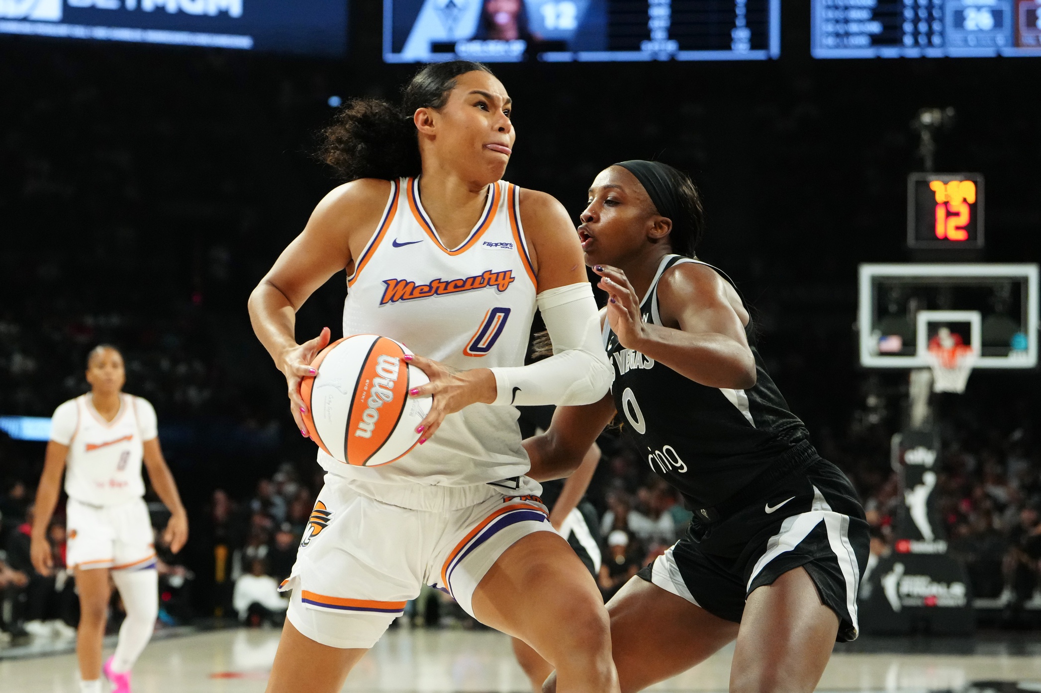 Oct 3, 2025; Las Vegas, Nevada, USA; Phoenix Mercury forward Satou Sabally (0) looks to shoot against Las Vegas Aces guard Jackie Young (0) during the second quarter of game one of the 2025 WNBA Finals at Michelob Ultra Arena. Mandatory Credit: Stephen R. Sylvanie-Imagn Images