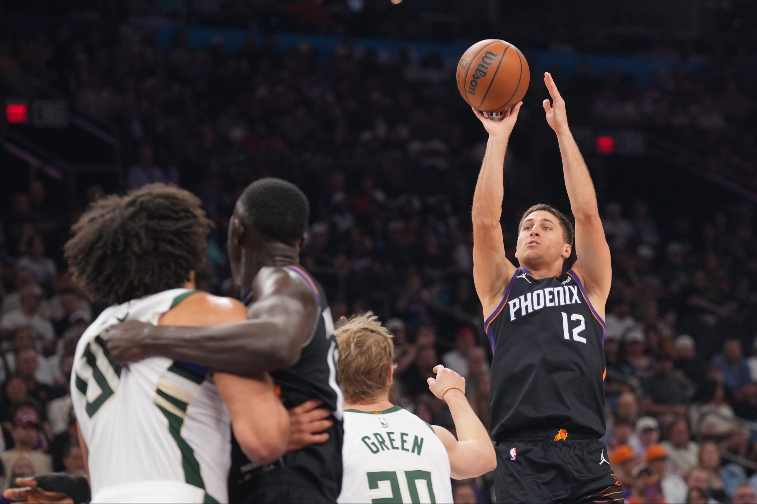 Mar 21, 2026; Phoenix, Arizona, USA; Phoenix Suns guard Collin Gillespie (12) shoots against the Milwaukee Bucks during the first half at Mortgage Matchup Center. Mandatory Credit: Joe Camporeale-Imagn Images