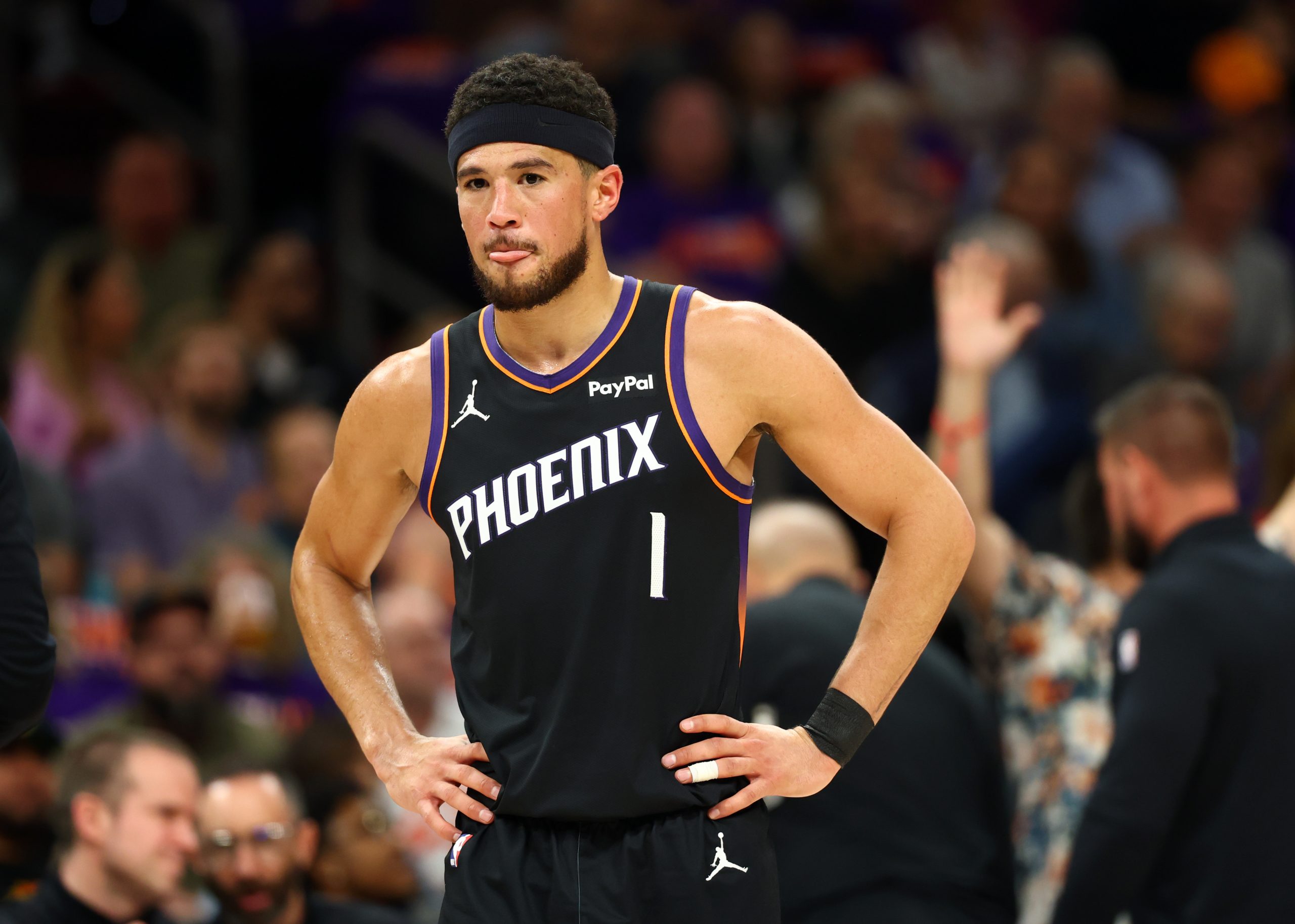 Apr 14, 2026; Phoenix, Arizona, USA; Phoenix Suns guard Devin Booker (1) reacts against the Portland Trail Blazers in the first half during the play-in rounds of the 2026 NBA Playoffs at Mortgage Matchup Center. Mandatory Credit: Mark J. Rebilas-Imagn Images