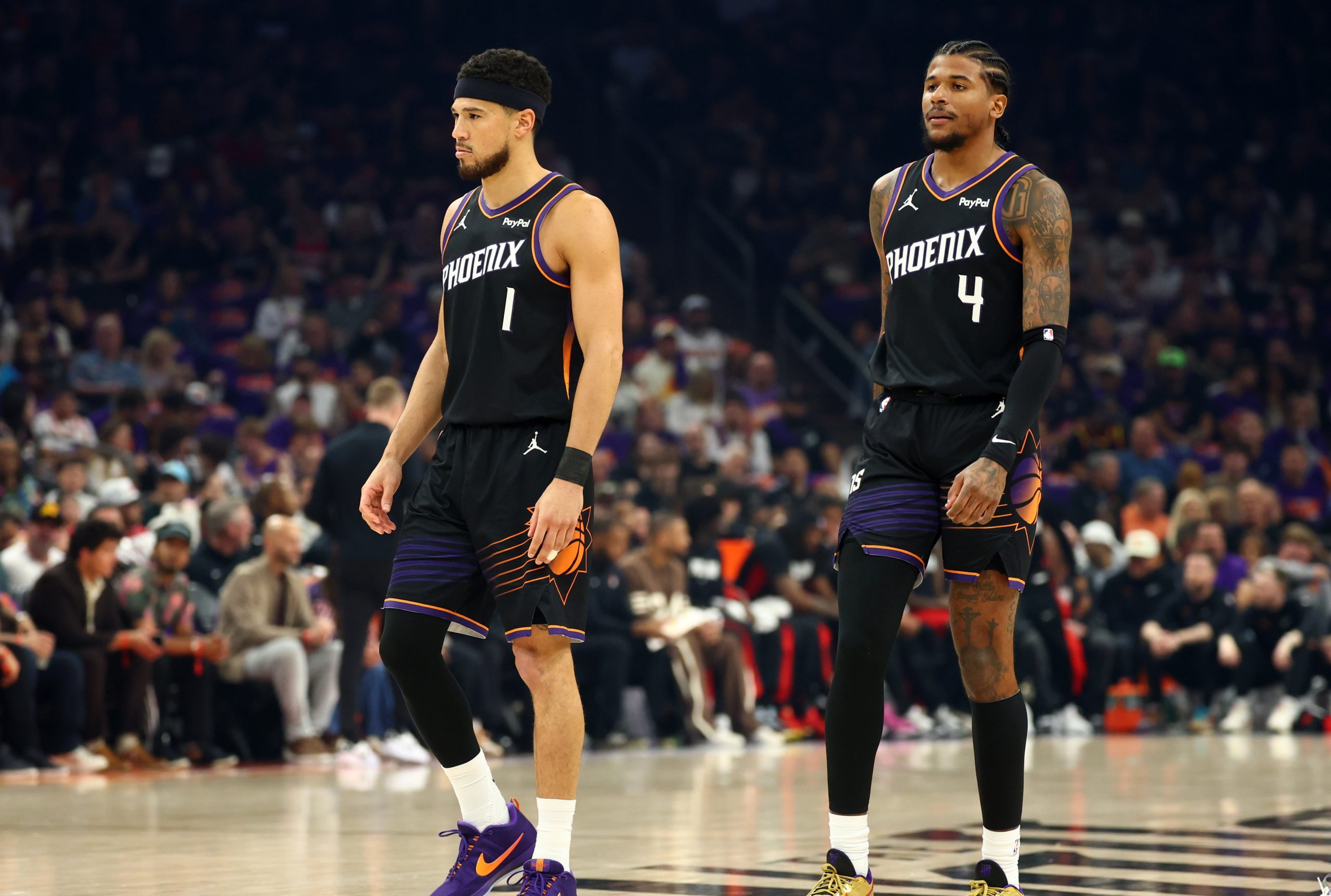 Apr 14, 2026; Phoenix, Arizona, USA; Phoenix Suns guard Devin Booker (1) and Jalen Green (4) against the Portland Trail Blazers during the play-in rounds of the 2026 NBA Playoffs at Mortgage Matchup Center. Mandatory Credit: Mark J. Rebilas-Imagn Images