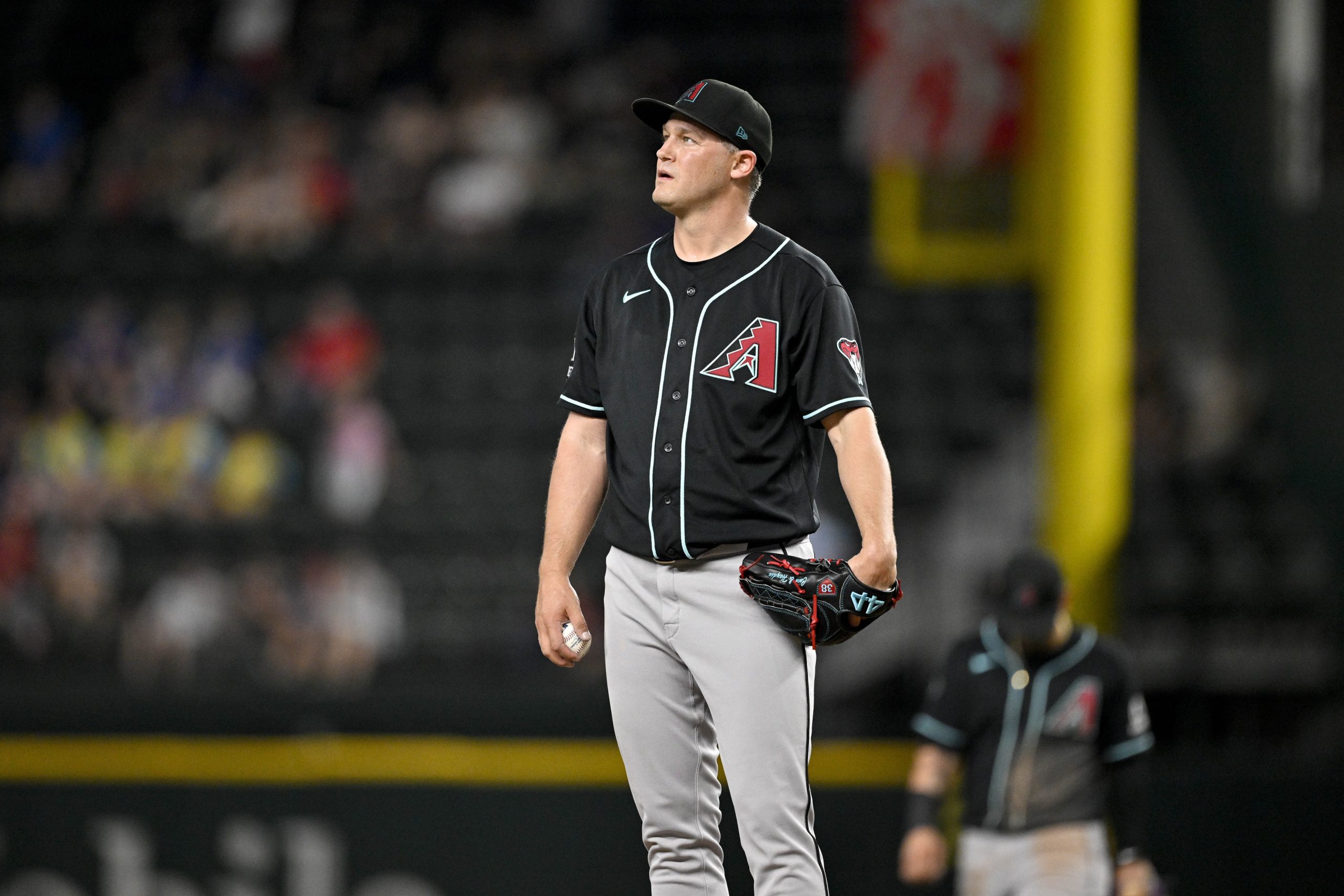 May 13, 2026; Arlington, Texas, USA; Arizona Diamondbacks relief pitcher Paul Sewald (38) looks on after he gives up the game tying run against the Texas Rangers during the ninth inning at Globe Life Field. Mandatory Credit: Jerome Miron-Imagn Images