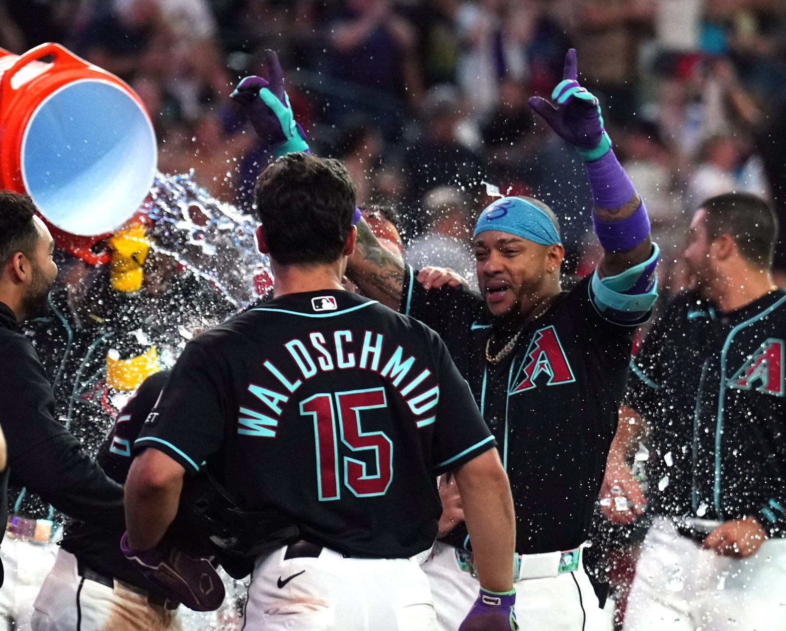 May 19, 2026; Phoenix, Arizona, USA; Arizona Diamondbacks second baseman Ketel Marte (4) is doused with water by teammates after hitting a three run walk off home run against the San Francisco Giants during the ninth inning at Chase Field. Mandatory Credit: Joe Camporeale-Imagn Images