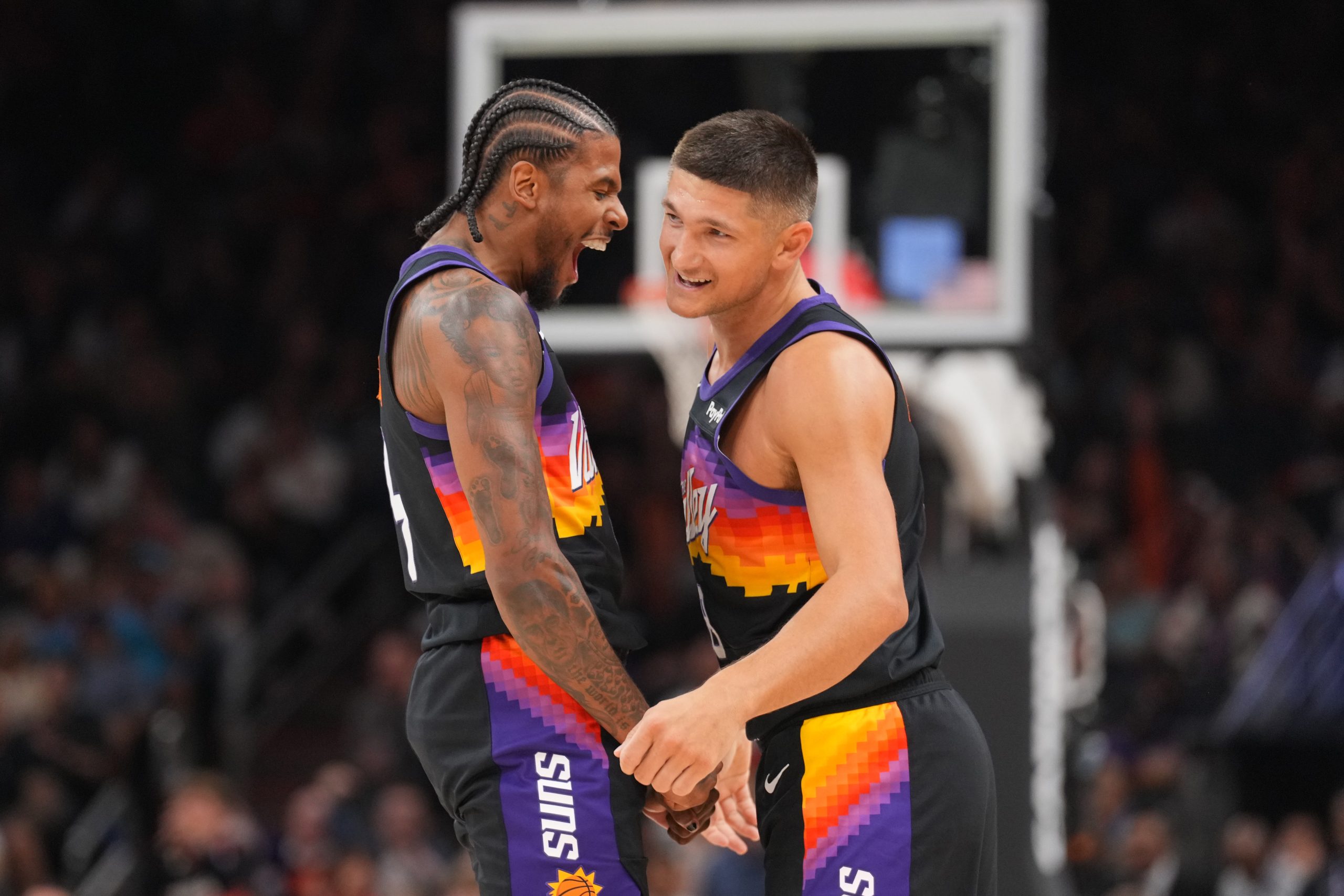 Mar 6, 2026; Phoenix, Arizona, USA; Phoenix Suns guard Jalen Green (4) celebrates with Phoenix Suns guard Grayson Allen (8) against the New Orleans Pelicans during the first half at Mortgage Matchup Center. Mandatory Credit: Joe Camporeale-Imagn Images