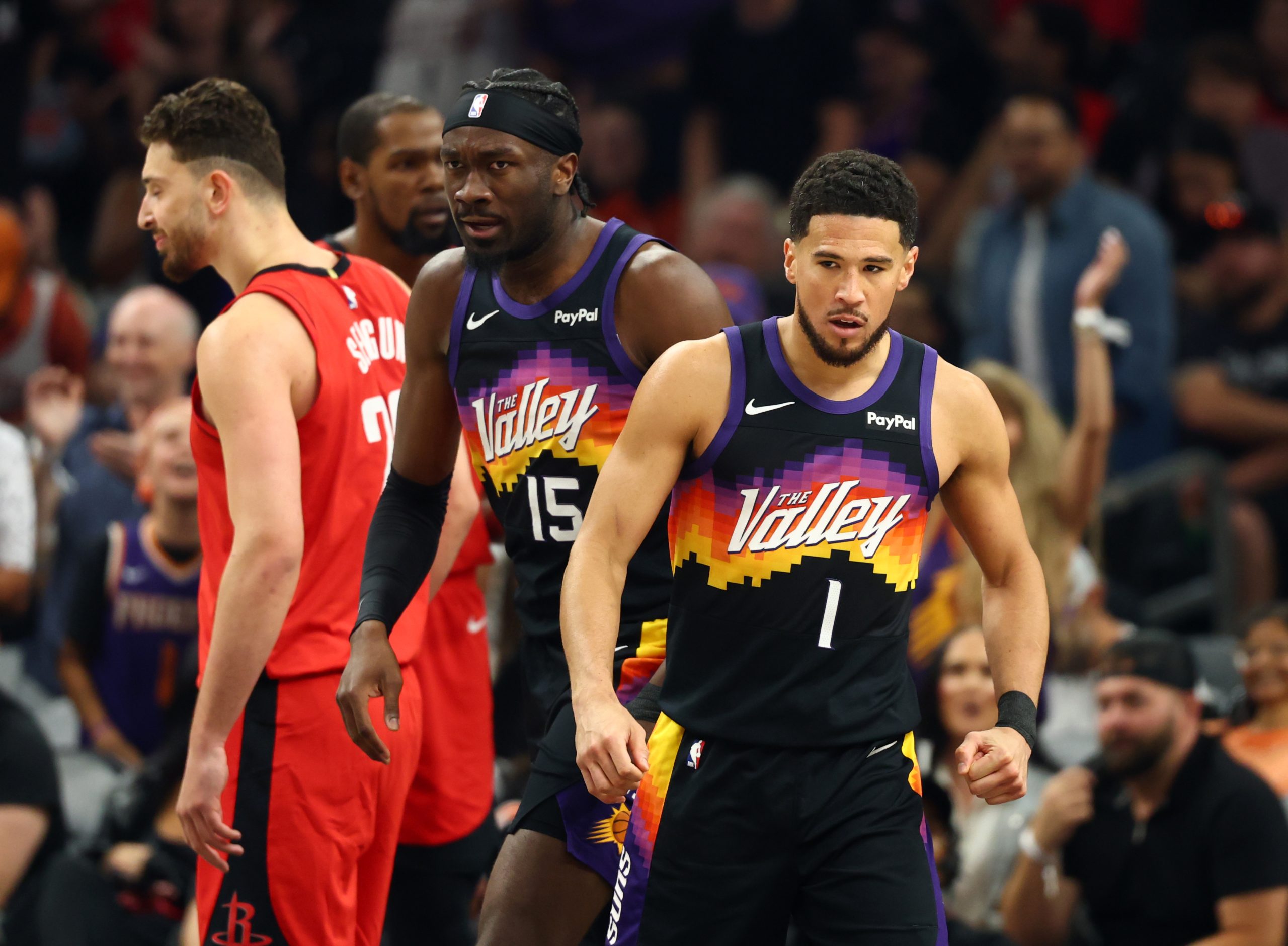 Apr 7, 2026; Phoenix, Arizona, USA; Phoenix Suns center Mark Williams (15) celebrates with Devin Booker (1) against the Houston Rockets in the first half at Mortgage Matchup Center. Mandatory Credit: Mark J. Rebilas-Imagn Images