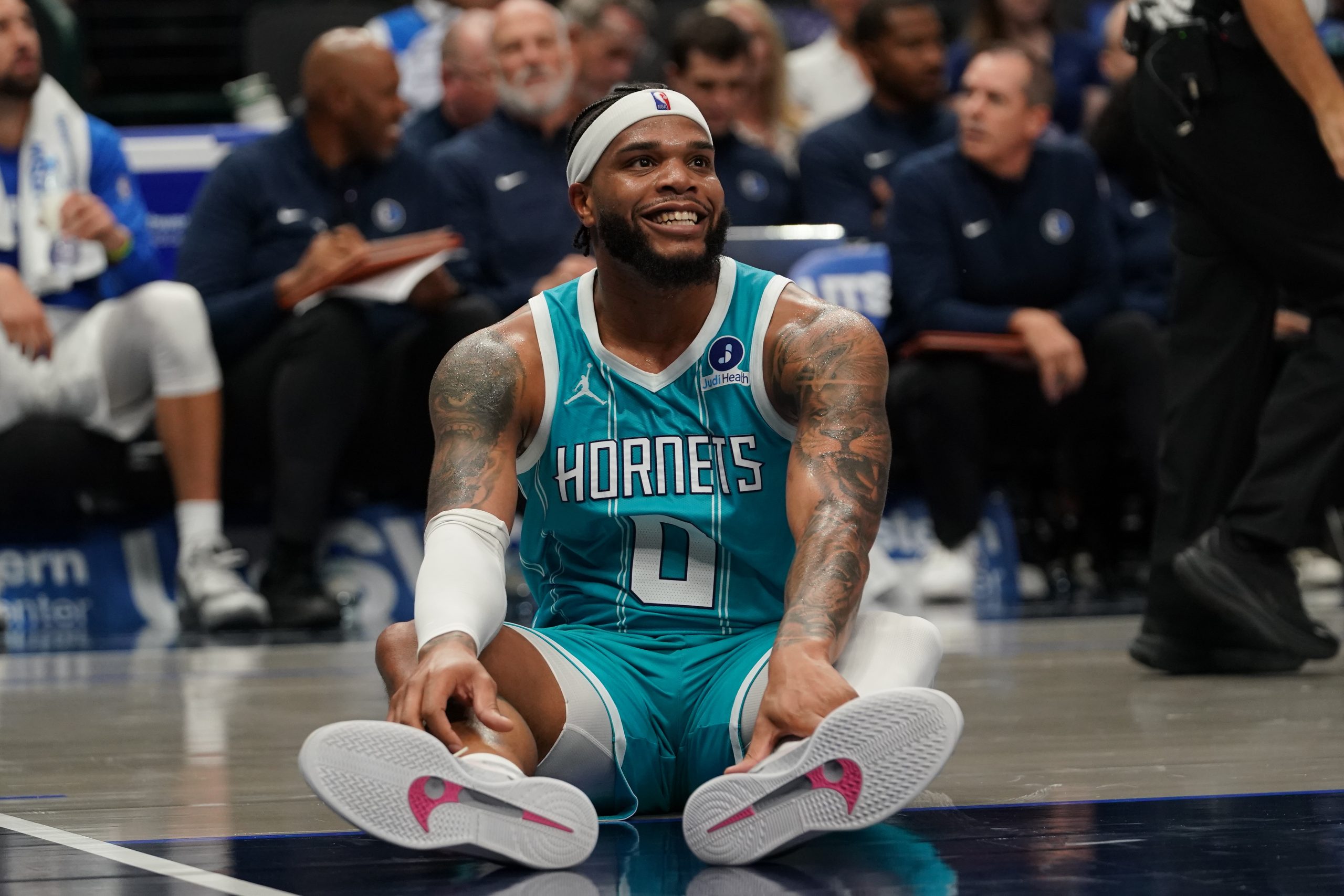 Oct 11, 2025; Dallas, Texas, USA; Charlotte Hornets forward Miles Bridges (0) smiles after being fouled against the Dallas Mavericks in the first half of a game at American Airlines Center. Mandatory Credit: Raymond Carlin III-Imagn Images