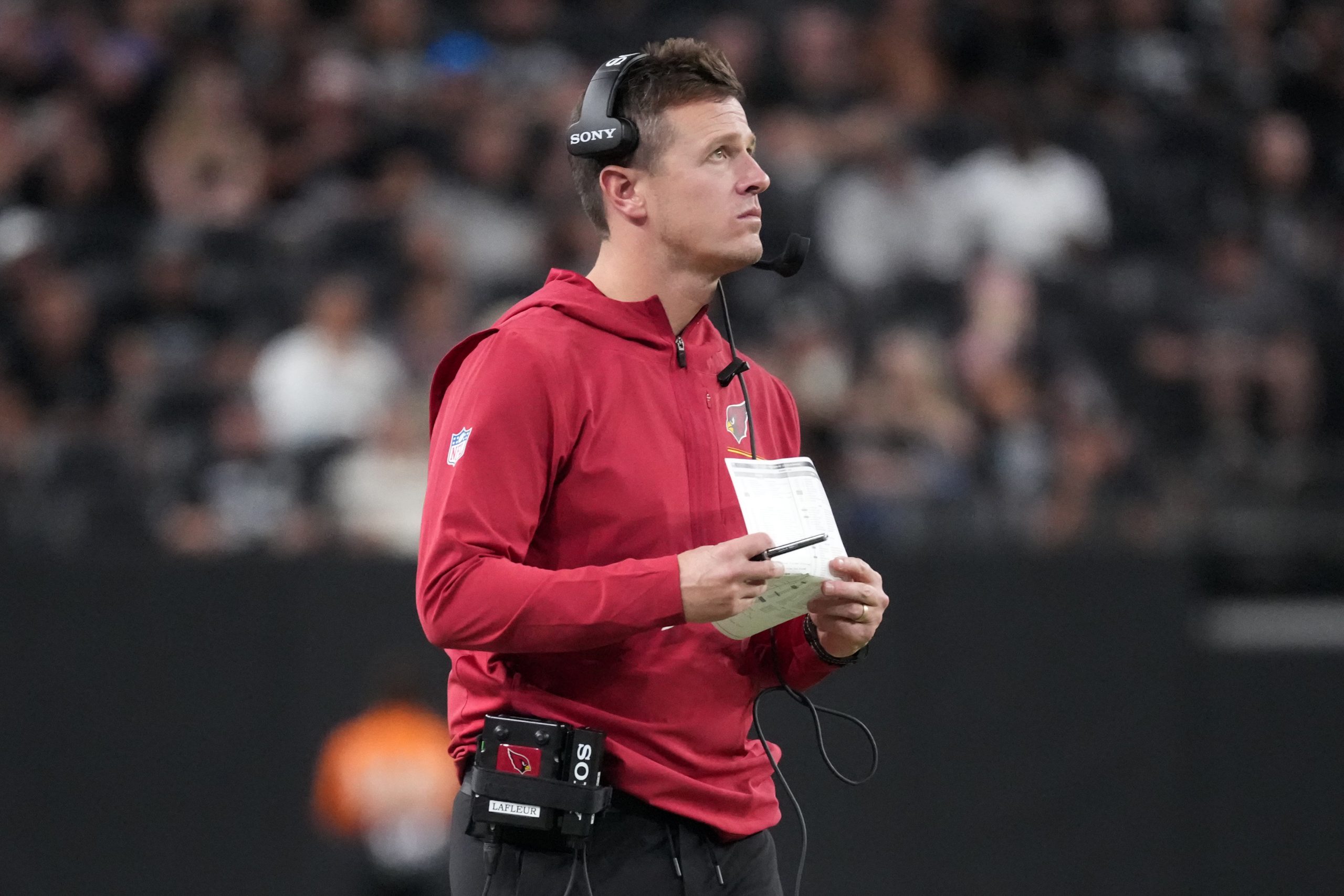 Aug 13, 2026; Paradise, Nevada, USA; Arizona Cardinals head coach Mike LaFleur watches from the sidelines against the Las Vegas Raiders in the second half at Allegiant Stadium. Mandatory Credit: Kirby Lee-Imagn Images