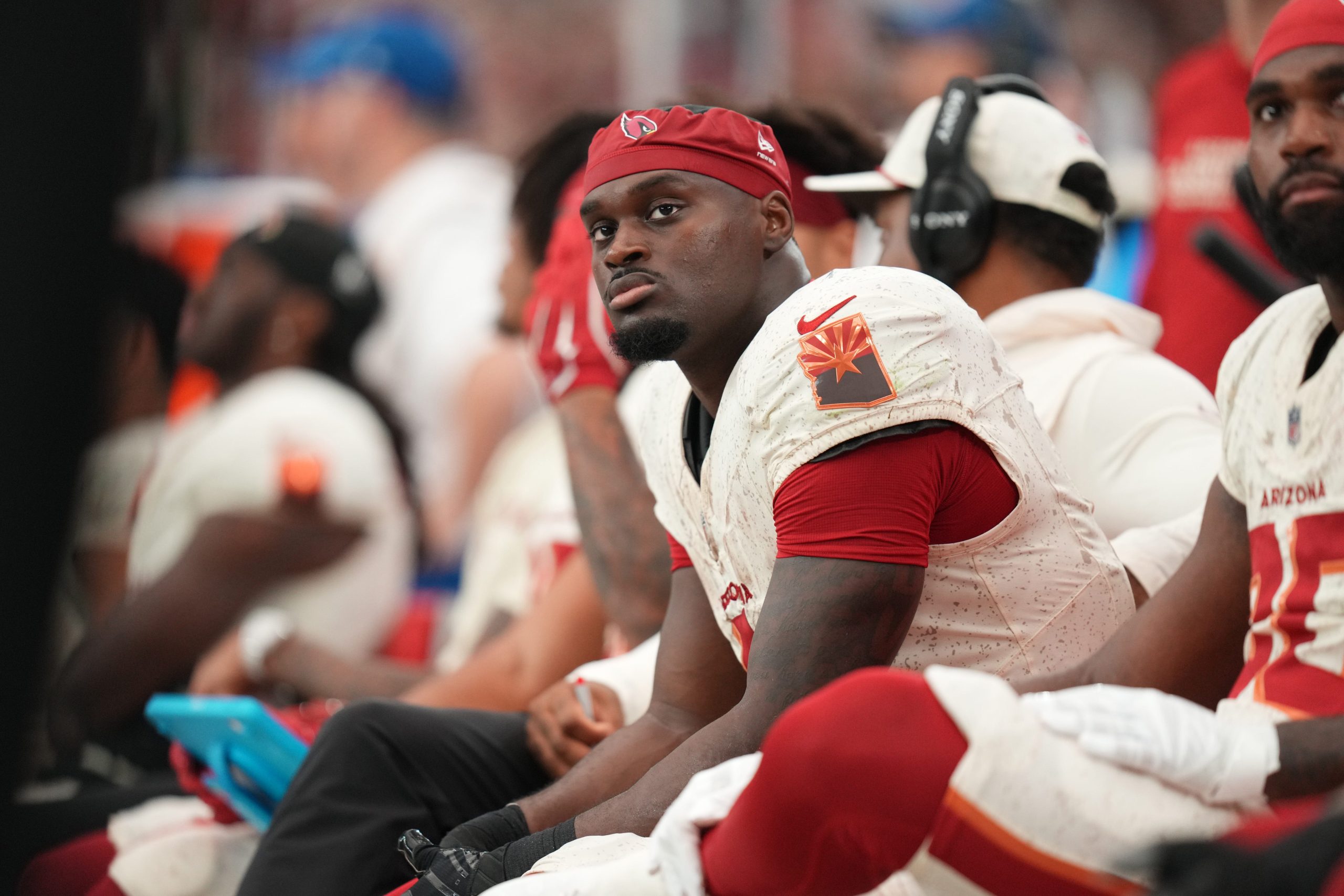 Arizona Cardinals running back Jeremiyah Love (4) looks on from the sideline as they play the Seattle Seahawks at State Farm Stadium in Glendale on Sept. 20, 2026.