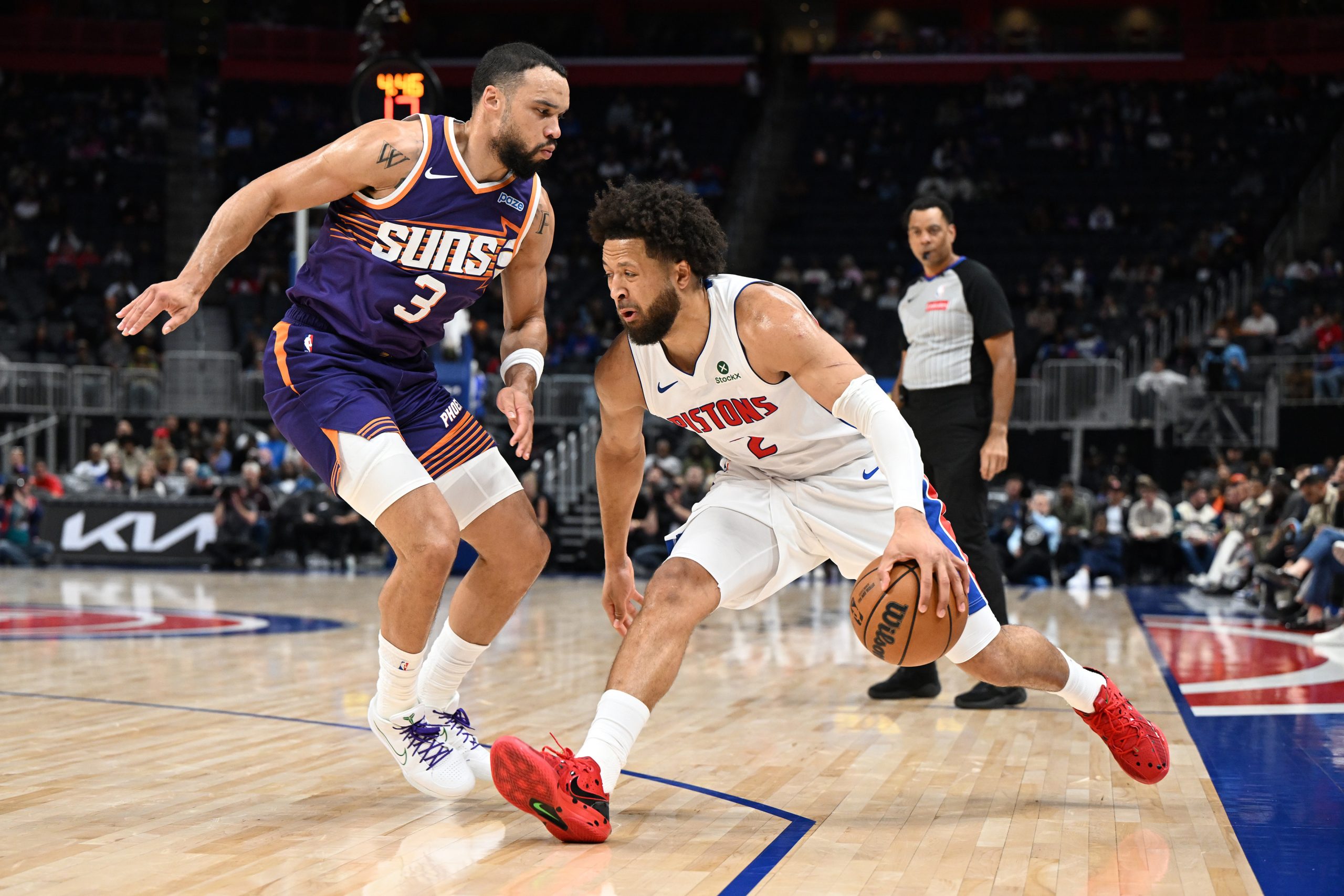 Oct 5, 2026; Detroit, Michigan, USA; Detroit Pistons guard Cade Cunningham (2) tries to drive past Phoenix Suns forward Dillon Brooks (3) in the first quarter at Little Caesars Arena. Mandatory Credit: Lon Horwedel-Imagn Images